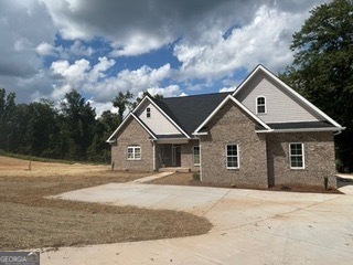 Worth the Wait! This stunning, newly completed home sits on a spacious 1.66-acre lot and offers the perfect blend of comfort and style. Featuring 3 bedrooms, 3 full baths, including the potential for two master suites, this one is designed for modern living. You will love the open floor plan with vaulted ceilings, a cozy fireplace, and track lighting. The oversized bonus room provides endless possibilities a media room, home office, or extra living space. The kitchen is a chef's dream with sleek granite top and stainless steel appliances. No HOA. This home was built with attention to details and space to grow. Private Remarks: