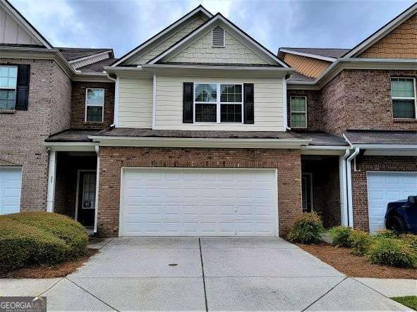 Gated Community: GORGEOUS 3BED/2.5BATH HM IN EXCELLENT NEIGHBORHOOD /JUST MINUTES TO I-85, HWY 29 & SHOPPING Excellent Gwinnett Schools. Convenient to I-85 and Ronald Regal Pkwy. Attached garage. Quiet safe community. Spacious rooms. Cozy fireplace in the living room. A private patio leads to the backyard. Convenient to shopping, entertainment, restaurants, and everything metro Atlanta has to offer. This townhome is a rare find in a prime location. Vacant.***Engineered wood floor entire house***water bill included.