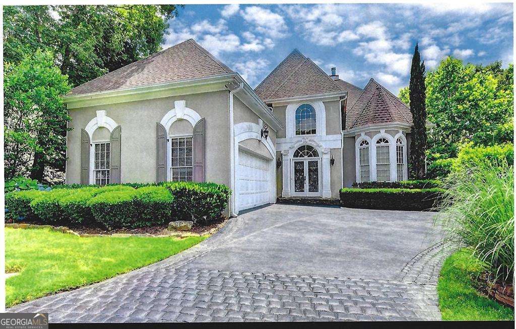 Experience refined living in this magnificent stucco cluster home perfectly positioned across from the scenic Chattahoochee Park. Located in a highly desirable community offering resort-style amenities-including tennis courts, multiple swimming pools, a clubhouse, and close proximity to premier golf courses-this home combines elegance, comfort, and convenience. Meticulously maintained and thoughtfully remodeled, every detail has been carefully considered. The kitchen is equipped with brand-new stainless steel appliances-refrigerator, stove, dishwasher, and microwave-set against granite countertops and a matching backsplash. An elegant marble foyer welcomes you, flowing into warm, real hardwood floors throughout the main level. The main-level owner's suite features a full bath and an en-suite retreat designed for relaxation. The expansive, unfinished basement offers endless possibilities-whether you envision a home theater, fitness studio, or additional living space. All this, just minutes from Avalon, The Forum, and North Point Mall, with easy access to shopping, dining, and entertainment. Just Listed - An Alpharetta gem with style, space, and a prime location.