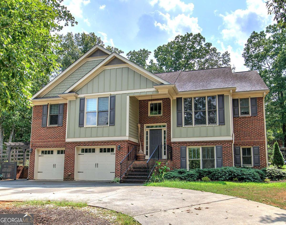 Beautiful 4BR/3BA Home on Private Wooded Lot in Cartersville School District - Tucked away on a serene, private wooded lot in a sought-after swim/tennis community, this spacious 4-bedroom, 3-bathroom home offers the perfect blend of comfort, style, and functionality - all within the desirable Cartersville City School District. Step inside to a welcoming great room with soaring vaulted ceilings and a cozy central fireplace, creating an ideal space for relaxing or entertaining. The formal dining room and sunny eat-in kitchen provide multiple dining options to suit any occasion. The kitchen is a chef's dream - featuring granite countertops, stained cabinetry, stainless steel appliances, a breakfast bar, and a massive walk-in pantry for all your storage needs. Retreat to the luxurious master suite, complete with vaulted ceilings, a peaceful sitting area, and a spa-inspired bath boasting double vanities, a walk-in shower, a soaking tub, and a large walk-in closet. Downstairs, the fully finished lower level includes a second living area or game room, a large laundry room with a mud sink, the fourth bedroom, and a full bathroom - perfect for guests, teens, or a private office space. Enjoy the outdoors year-round from the large screened-in back porch overlooking the fenced backyard. Additional features include an oversized garage with a workshop/storage area, a circular driveway for ample parking, and high-speed fiber optic internet - ideal for remote work or streaming. Don't miss your chance to own this incredible home in a vibrant, family-friendly community!
