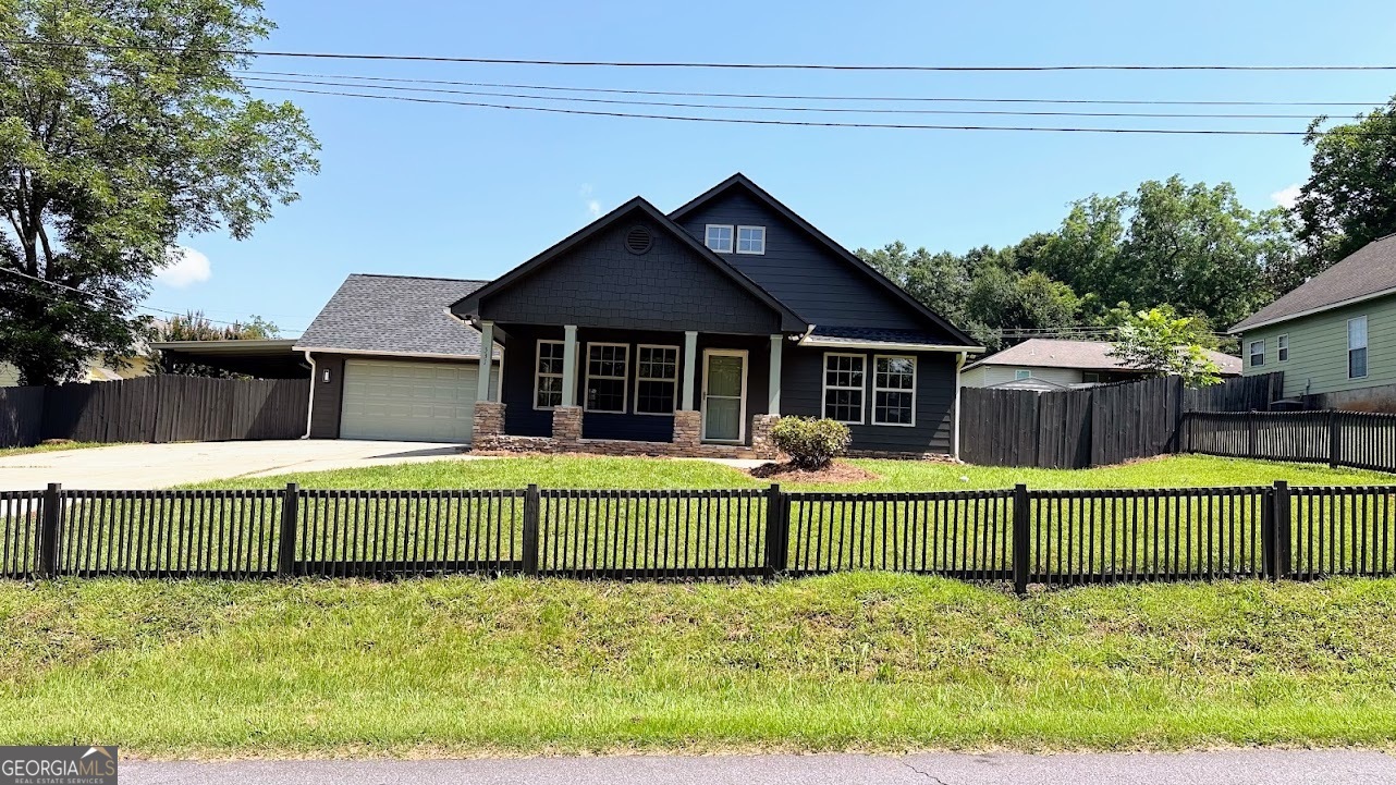 Charming 3 Bed, 2 Bath Home in Downtown Dadeville - Near Lake Martin & Auburn! Welcome to this beautifully updated 3-bedroom, 2-bath home located in the heart of downtown Dadeville, AL, just minutes from Lake Martin and a short drive to Auburn - perfect for lake lovers, game day weekends, or convenient small-town living. Inside, you'll find engineered hardwood floors throughout, fresh paint inside and out, a brand new roof, new HVAC, new water heater, and stylish quartz countertops in both the kitchen and baths. The kitchen also features stainless steel appliances and plenty of cabinet space. Step outside to enjoy covered front and back porches and a privacy-fenced backyard-ideal for entertaining, kids, or pets. Whether you're looking for a full-time residence, game day getaway, or investment property, this turn-key home offers charm, comfort, and convenience in a prime location.