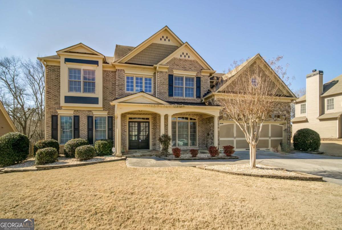Welcome to your LAKE VIEW home in the Swim/Tennis community of Lakefield Manor. Throughout you will find gleaming hardwoods and professionally cleaned carpets. The grand main level boasts a guest Bedroom, full bath, formal Livingroom & Dining room, family room w/fireplace & built-ins off of a grand gourmet kitchen. Kitchen is loaded with wood cabinets, granite counter tops, SS appliances & walk-in pantry. Breakfast bar island with ample storage and breakfast area. Upstairs is a spacious master bedroom suite with tiled master bath, soaker tub, abundance of vanity counterspace and oversized walk-in closet. 4 large secondary bedrooms with walk-in closets, 2 tiled bathrooms and an additional bonus room! Outside the level, landscaped yard is professionally maintained with irrigation system plus a patio, gazebo with deck, and multi-purpose building both with electricity. 2 sets of Full amenities (Pools, tennis courts, and playground) are within walking distance along with lakefront access. EV charging available in the 2-car garage. Professionally cleaned and ready for move in! Not to mention miles & miles of exploring in the nearby Kennesaw Mountain National Park, quick access to the East-West Connector & Hwy 120, plus countless entertainment options in the quaint Downtown Marietta Square.