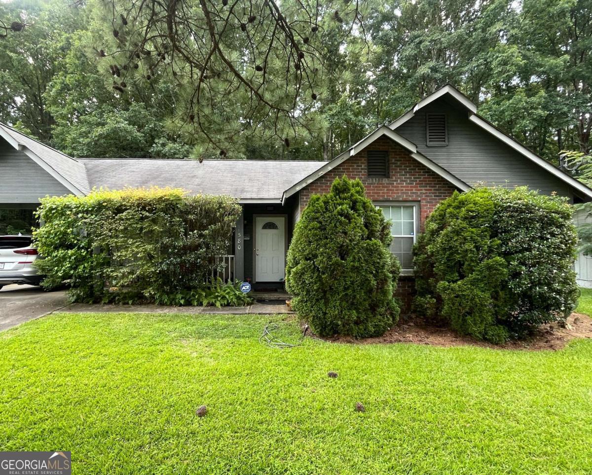 This 3-bedroom, 2-bathroom well-kept charmer is conveniently located near shopping, dining, and entertainment. Let's start with the covered front porch which is a lovely space for sipping morning coffee or afternoon tea. Step inside onto stylish laminate flooring featured throughout most of the home and neutral paint color, adding a modern touch. This residence boasts vaulted ceilings in the mail living areas and high ceilings in the other rooms, creating an open and airy feel. Spacious yard is perfect for outdoor relaxation and entertaining. With newer water heater and all systems functioning, this home is turnkey! Enjoy the convenience of ample off-street parking on the extended driveway and covered carport. Ideal opportunity for an owner-occupant who is ready to bring their vision to customize this home...or an investor looking for their next great deal! With quick access to Interstate 285, Hartsfield-Jackson Atlanta International Airport, and Herbert Greene Nature Preserve, this home places the best of the city at your fingertips. Schedule a tour today!