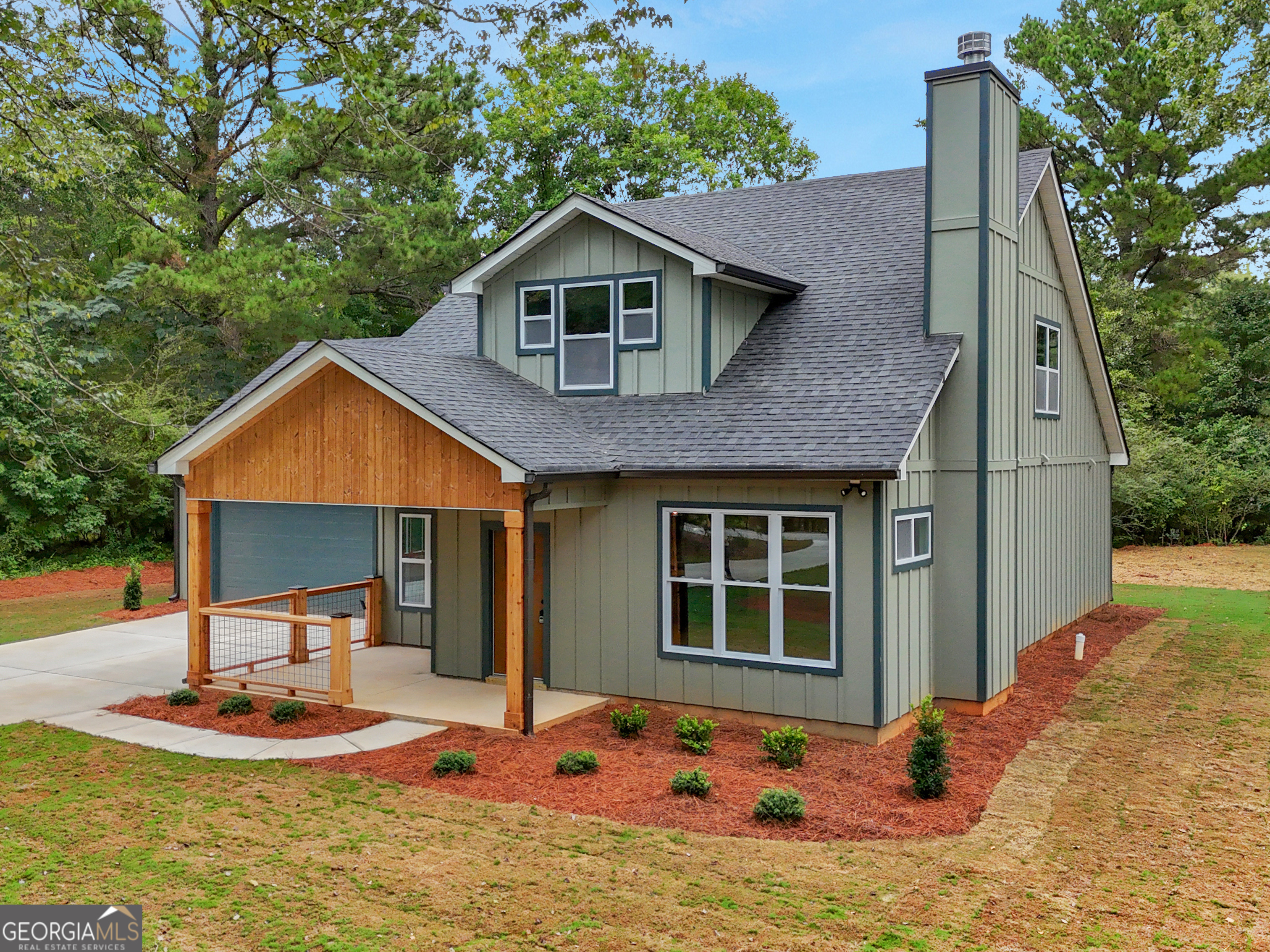 Welcome to this newly constructed Craftsman home in the highly desirable city of Senoia. Set on a large picturesque lot with mature trees and a fresh sod lawn. Designed with quality craftsmanship and thoughtful detail throughout. The front porch, complete with tongue-and-groove pine ceiling, recessed lighting, and cedar railing, is the perfect spot for morning coffee. Enter in to the spacious living room with stacked-stone fireplace and large windows overlooking the lush front yard. The open dining area and stunning kitchen are ideal for entertaining; featuring an island with ample seating, large pantry, custom tilework, and abundant storage with soft-close cabinetry. Just off the kitchen, you'll find a bar nook, versatile mudroom/butler's pantry, and convenient guest half bath. The primary suite is a private retreat with serene backyard views. Its bath boasts double vanities, lighted mirrors, a dual-head full tile shower plus an outlet for an electric bidet. A smart laundry-to-closet connection adds ease and efficiency; warm your clothes in the dryer right off your own suite! Upstairs there are two spacious bedrooms with large closets, a shared bath with separate vanity and shower area; perfect for busy mornings. The finished two-car garage includes recessed lighting, painted walls to match the home, a quiet-close automatic door, and pull-down stairs to floored attic storage, making it as functional as it is polished. Both closets on the main floor have electric outlets for recharging your vacuum cleaner or housing your boot warmers. *** This home is eligible for USDA financing- ask how you may qualify for 100% financing with no down payment! exclusions may apply*** Contact me today to ask how you can receive up to $1500 credit by using one of our preferred lenders. Exclusions may apply. Don't miss this rare opportunity to own this stunning new home in sought-after Senoia-schedule your showing today!