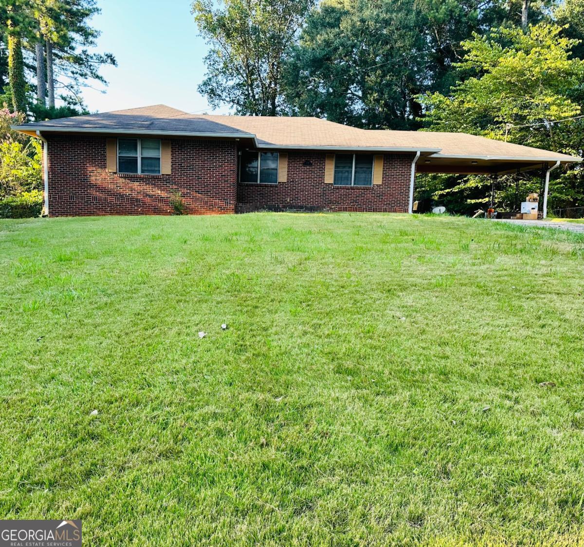 Discover the potential of this classic red brick ranch, situated in a well-established and meticulously maintained neighborhood in the Cascade area. This home features two spacious bedrooms, a full bathroom, a cozy family room, a dining room, and a kitchen on the main level. Large windows throughout provide an abundance of natural light, creating a warm and inviting space. This home has a large, fenced backyard, ideal for outdoor gatherings or quiet evenings. A bonus is the unfinished basement presenting a fantastic opportunity for customization, with ample space for two additional bedrooms, a bathroom, and a bonus room-ideal for a home theater, gym, or playroom. While the home requires renovation, its inherent charm and layout promise endless possibilities for those looking to create their dream space. With a prime location just minutes from local amenities, parks, and dining, and I-285 this property is perfect for anyone seeking a project in a sought-after community. Don't miss the chance to transform this ranch into your ideal home and capitalize on its tremendous potential!
