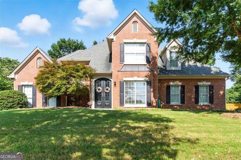 Incredible home located just minutes from downtown Suwanee in the desired community of Ruby Forest. Sitting on a cul-de-sac lot, this is a dream come true with your own back yard oasis. Brick facade with stucco accents on front of home. Iron front, double door entry leads to a wide foyer that opens to your large, vaulted family room with a beautiful brick, wood burning fireplace. Family room is open to the kitchen and breakfast area. This 4 bedroom, 2 & 1/2 baths home has the Owners suite on the main level has a vaulted trey ceiling and crown moulding. The awesome updated master bath includes a double vanity, jetted garden tub, separate shower and private water closet. The large clothes closet is also off the bathroom. Upstairs you'll find three additional bedrooms very generous in size with one having a vaulted ceiling. A nice tiled full bath is in the hall on the upper level, the stairs and three bedrooms are carpeted. With the exception of the tiled primary bath the remaining main level is high grade waterproof LVP. The kitchen has a bar counter that is open to the family room and breakfast area. Silestone countertops, tile backsplash, stainless steel sink and stainless-steel appliances to include Bosch very quiet dishwasher, GE single double oven and a separate Bosch 5 burner gas cooktop. The microwave is located above the cooktop. A lot of cabinets, this is a Bakers dream kitchen! Leading off the kitchen is the half bath and laundry room. The formal dining area is accessed from the kitchen or front foyer. The breakfast area is generous in size and the pantry is located in this area. Enter this area from the side entry garage. The breakfast area overlooks an incredible enclosed all season patio/screen room with infrared heaters and stamped pavers. This room leads to a gorgeous flowering, landscaped back yard with play area on one side and the OASIS on the other. Full tall privacy fenced backyard, firepit with wall seating, Salt water gas heated Sport pool and combined hot tub with Hayward pool equipment. Pool is gunite with pebble finish. The pool is completely surrounded by Stone pavers. This area is absolutely stunning! There is an entry/exit gate to the driveway as well. So many upgrades to this home, entire home plumbing replaced with plumbing in attic for easy access. Eliminated all Poly piping, wireless security system, newly replaced garage door and architectural shingled roof. A bonus..this home has direct access to a little over nine miles of walking trails between Suwanee creek and Ivy creek greenway running by Suwanee town park and through George Pierce Park. Don't miss this one, it is a very well-maintained home waiting for new owners to love it as the original owners have.