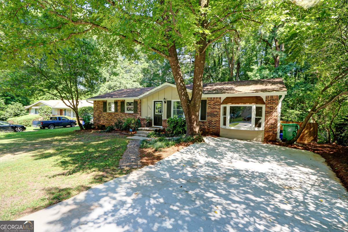 For Lease - Renovated Ranch in Storybook Estates $2,595/month - 2968 Fantasy Lane, Decatur, GA 30033 - Welcome to this beautifully renovated 4-bedroom, 2-bath brick ranch in the heart of Decatur's desirable Storybook Estates. This charming home offers a thoughtful blend of classic design and modern upgrades - including a brand-new driveway and freshly updated interiors - making it truly move-in ready. Step inside to discover gleaming hardwood floors throughout and a bright, open-concept living space. The spacious family room is bathed in natural light and flows seamlessly into the stylish eat-in kitchen, featuring granite countertops, upgraded appliances, and a view to the living area - ideal for entertaining or everyday living. The oversized primary bedroom boasts a generous walk-in closet, while three additional bedrooms offer flexible space for guests, a home office, or a playroom. A versatile bonus room with a bay window and barn door adds even more functionality to the floor plan. Enjoy the outdoors on your private deck and patio, surrounded by a fully fenced backyard - perfect for weekend barbecues or peaceful mornings. The home sits on a beautifully landscaped, level lot and is conveniently located near top-rated schools, parks, and public transit. * Renovated interiors ? New driveway * Large fenced yard with deck & patio * Walk-in closet in primary suite * Bonus/4th Bedroom room for added flexibility * Pets allowed (with deposit) * Available now for 12-month or 24-month lease