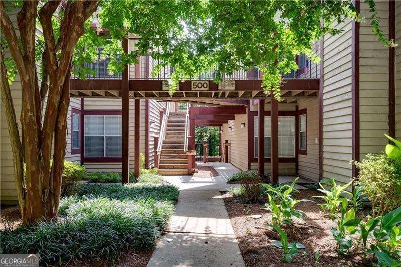 Beautiful 2BR/2BA Condo in Sought-After Rivermont Village - Prime Location! Welcome to this immaculate and updated 2-bedroom, 2-bathroom condo nestled in the highly desirable Rivermont Village community. Enjoy unbeatable convenience with easy access to Alpharetta, Roswell, major interstates, top-tier shopping, dining, and more. This unit boasts a serene view of the peaceful woods-not the busy parking lot-offering privacy and a true sense of retreat. The spacious open-concept floor plan is filled with natural light, thanks to a stunning wall of windows that frame the wooded landscape. Step out onto the back deck and unwind in your own private oasis. The bright kitchen is a chef's dream, featuring custom cabinetry, granite countertops, and plenty of space for meal prep and entertaining. The adjoining dining area flows seamlessly into a cozy great room complete with a wood-burning fireplace-perfect for relaxing evenings or hosting friends. The oversized Master Suite offers a luxurious escape with a large walk-in closet (plus an additional storage loft for seasonal items or decor) and a spa-like bath complete with a soothing whirlpool tub. The generously sized secondary bedroom is ideal for guests, a home office, or a roommate setup. Enjoy the many amenities Rivermont Village has to offer, along with a quiet, well-maintained community atmosphere. This one won't last-schedule your showing today!
