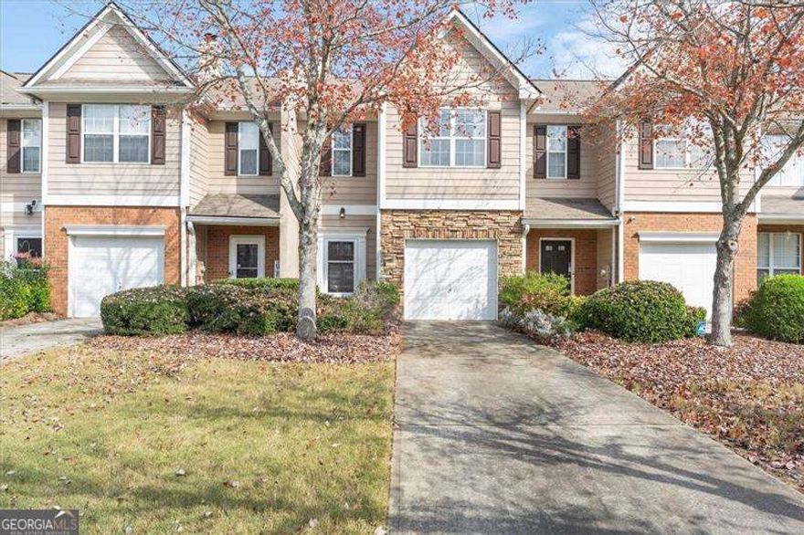 Welcome home to 182 Oak Green Drive - a cozy and cheerful townhouse in the heart of Lawrenceville. This bright and happy three-bedroom home gives you the space you need to relax, work, and enjoy life every day. Step inside and you will feel right at home. The main level has an easy, open layout that makes spending time with friends and family a joy. A warm fireplace brings comfort on cool nights, and the natural light makes the whole space feel fresh and inviting. The kitchen has plenty of room for cooking your favorite meals, and the dining area is perfect for simple dinners or family celebrations. Upstairs you will find three comfortable bedrooms, including a peaceful primary suite with its own bathroom. Home has two and a half total bathrooms, so mornings will stay simple and stress-free. This home sits in a friendly community with sidewalks and a calm, level yard. You will love having an attached garage, and a low-maintenance lot that gives you more time to enjoy life. Built in 2001 and well-cared for, the home offers solid value and long-term comfort. Living here also means being part of Gwinnett County, known for great schools and steady growth. The area has experienced continued investment in strong services and thriving neighborhoods. Perfectly located just moments from the historic alluring downtown Lawrenceville, you'll have easy access to fantastic dining, shopping, and entertainment. Commute will be easy, as home is not far from major highways such as GA-316 and I-85. This is the kind of home that makes every day feel easy, warm, and welcoming. Come see why 182 Oak Green Drive could be the perfect next step for you.