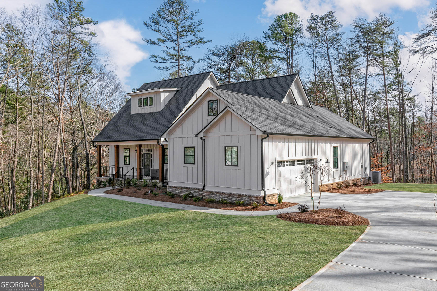 The Yonah | Where Refined Living Meets Timeless Design Welcome home to the Yonah, an exceptional split-level residence that seamlessly blends sophisticated style with functional comfort. From its charming modern farmhouse exterior to its expansive, thoughtfully designed interior, every detail of this home was crafted to elevate your lifestyle. Step through the welcoming entryway and into an open, airy layout where natural light pours into the spacious family room, anchored by a cozy gas fireplace. Perfectly positioned for entertaining, the chef-ready kitchen is adorned with sleek granite countertops, stainless steel appliances, subway tile backsplash, and an oversized island that effortlessly connects to the dining area. A walk-in pantry and 42" upper cabinets with crown molding ensure there's a place for everything. The split-level design offers maximum privacy and flexibility, with two generously sized secondary bedrooms ideal for children, guests, or a dedicated home office. At the end of the day, retreat to the secluded owner's suite, a true sanctuary featuring a spa-inspired en-suite bath with a luxurious soaker tub, separate glass-enclosed shower, and a sprawling walk-in closet. Outdoors, enjoy both a covered front porch perfect for peaceful mornings and an expansive covered outdoor kitchen ideal for hosting under the stars-all nestled on a spacious acreage homesite. Highlights Include: * Chef-ready kitchen with granite island & gas cooktop with griddle * Private owner's retreat with spa bath and oversized walk-in closet * Covered outdoor kitchen and spacious covered front porch * Large laundry room with abundant storage * Stainless steel appliances and walk-in pantry * Ceiling fans throughout and open-concept living areas * Attached two-car garage on an acreage homesite Whether you're hosting gatherings or enjoying quiet moments, the Yonah invites you to live life to the fullest-graciously, beautifully, and without compromise.