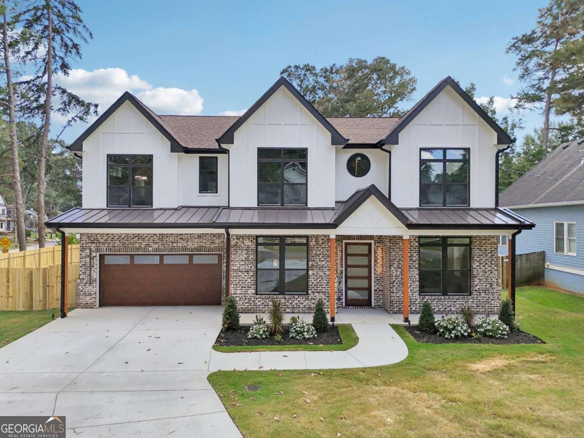 Experience modern luxury in this newly built custom farmhouse, blending high-end design with smart home technology! Situated on a prominent corner lot with no HOA, this residence offers nearly 3,560 sq ft of sophisticated living in a prime Atlanta location. With 5 bedrooms, 4.5 baths, and a versatile bonus room, the layout includes three owner's suites-one on the main level and two upstairs-each with spa-style baths and generous walk-in closets, including a California-style primary closet. Highlights include soaring 10-foot ceilings & 7-foot windows, walnut hardwood floors, two-story foyer, formal living and dining, and a chef's kitchen with quartz counters, statement island, smart Forno appliances, 48" stove w/ pot filler, custom cabinets, and bold finishes. The kitchen opens to a family room with fireplace and a keeping room overlooking the covered porch and fenced backyard retreat with pergola. Additional features: dual laundry rooms, designer lighting, 8-foot doors, raised back porch, security system, and seamless indoor-outdoor living. Other upgrades include fully insulated garage, and smart home system including locks, HVAC, and 2 smart toilets for a 5-star experience. Conveniently close to East Lake Golf Club, downtown and midtown, MARTA, and top Atlanta attractions. Don't miss your opportunity to tour this home today!