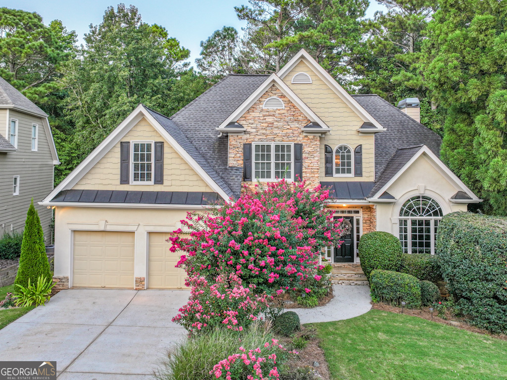 WELCOME HOME to 994 Fairview Club Circle in the premiere, RESORT-STYLE community of Apalachee Farms! As you walk in the front door, you are greeted with a grand two-story foyer full of natural sunlight. A spacious dining room is perfect for gatherings, while the formal living room with large window and French doors offers versatility as a home office. The open kitchen features granite counters, an island, pantry, and a sunny breakfast area overlooking the wooded, private backyard. The kitchen flows into the two-story family room with cozy fireplace and oversized picture window. The large OWNER'S SUITE on the MAIN FLOOR has trey ceilings and includes a spa-like bath with whirlpool tub, tiled shower, and large walk-in closet. There's also another bedroom on the first floor with a connecting bathroom that would make a great in-law guest suite or office. Upstairs are three more oversized bedrooms, providing plenty of space for family or guests. The FINISHED BASEMENT level offers multiple entertainment options with a pool/game room, office, full bath, and a HUGE STORAGE-AREA with built-in workbench for projects and tool storage. Step out onto your deck to enjoy your coffee or a glass of wine and the beautiful sounds of birds chirping! Or enjoy the covered patio underneath surrounded by nice landscaping and a view of the pond. The neighborhood is made up of five sections: Club View, Sterling Green, Riverside, The Terraces, and The Oaks. Residents enjoy eight tennis courts with a full-time tennis pro, two pickleball courts, multiple pools including Jr. Olympic, splash, slide, and adult pools, a hot tub, fitness center, clubhouse, tennis center, playground, and picnic pavilion. The HOA maintains community assets and amenities to help preserve property values and ensure a well-funded, thriving neighborhood. Conveniently located just minutes from Hebron Christian Academy, Hwy 316, I-85, and the Mall of Georgia. Call to schedule a tour today!
