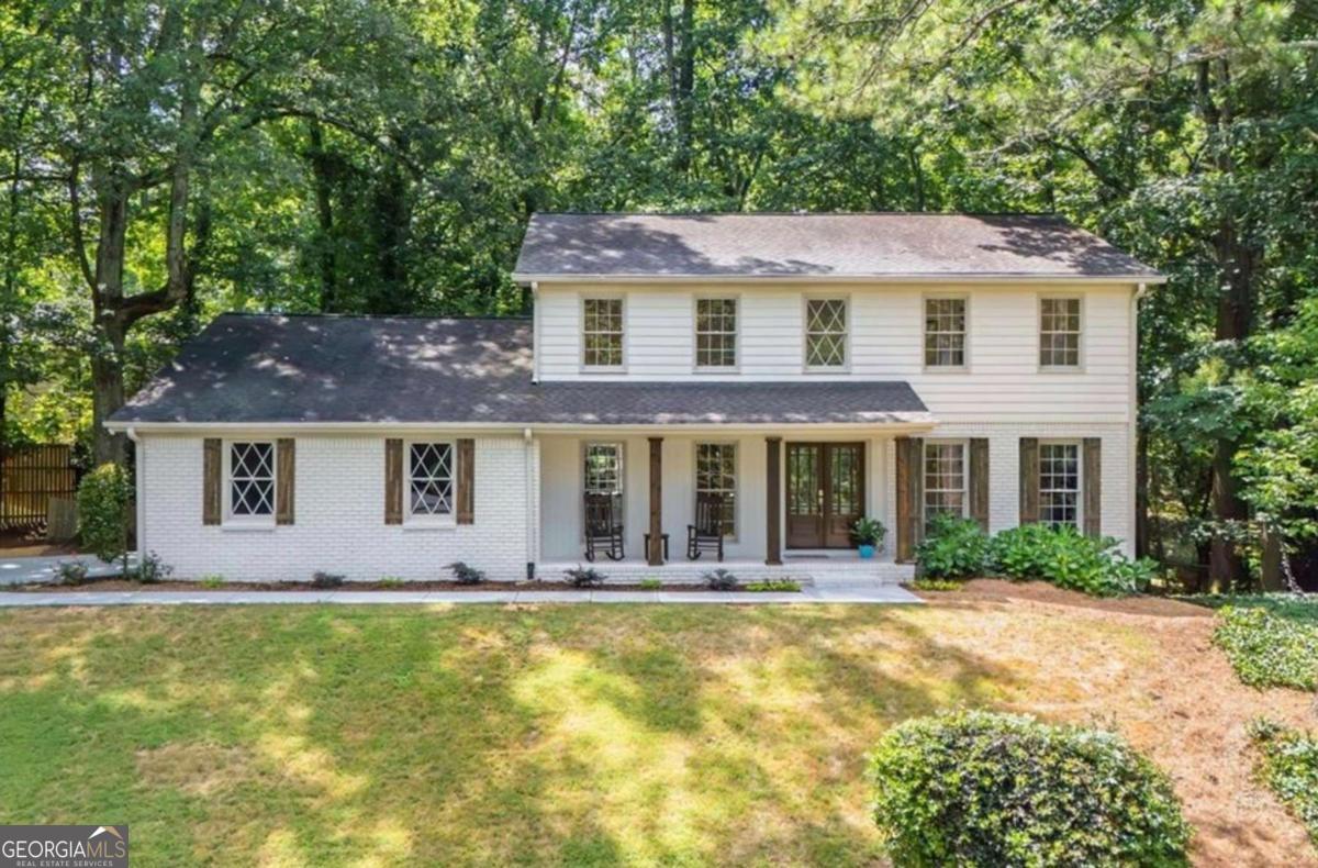 Top-to-Bottom Renovation in the Heart of Sandy Springs Park District! This FULLY REMODELED classic traditional has been gutted to the studs and transformed into a stunning modern home in the coveted Sandy Springs! Unleash your inner chef with the professional-grade 48" Forno gas range with 8 burners and double ovens, all centered around a MASSIVE QUARTZ island featuring a striking waterfall edge - perfect for hosting and family gatherings. Enjoy the luxury of all things NEW: NEW interior & exterior paint, NEW refinished hardwood floors, NEW Stylish fixtures, BRAND NEW appliances, NEW designer showers and vanities, Two NEW HVAC systems, and a NEW pristine concrete driveway. This brick and frame beauty is 100% move-in ready. Whether relaxing on the rocking chair front porch or entertaining on the back deck, you'll feel right at home. Prefer to explore? Walk to the scenic 24-acre Lost Corner Nature Preserve just around the corner at Brandon Mill and Dalrymple. Location, Location, Location! Minutes from restaurants, the city green, and theatre at the Sandy Springs City Center... quick access to GA-400, I-285, East Cobb, Downtown Roswell, and the Chattahoochee River. Optional membership available at Mark Trail Swim, Tennis & Pickleball Club. See tour here or click blue house icon with the arrow https://show.tours/v/8sXVXvc