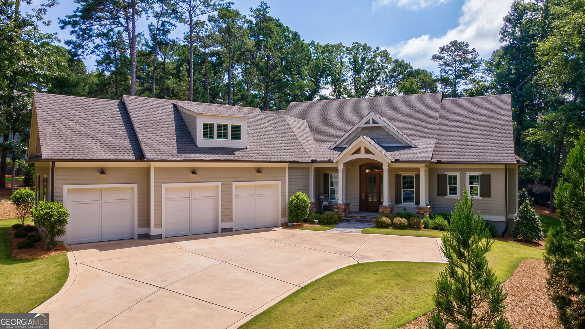 Beautifully appointed custom home with expansive golf course views in the heart of renowned Reynolds Lake Oconee. Built in 2022 and meticulously maintained, this like new home offers both luxury finishes and quality upgrades throughout. Open concept plan with a large great room featuring vault ceilings and a fireplace, open to a large and inviting sunroom with walls of windows to the golf course and a second fireplace. Kitchen and breakfast bar boast quartz counters and an eat-in area in addition to the dining room. Owners Suite on main offers a very spacious spa-like bath and walk in closet with two more bedrooms and baths onthe main level. Upstairs is a huge, very private suite with full bath ideal as a guest room, bunk room, home office, game room or fitness space! Situated on a quiet cul-de-sac, overlooking the Preserve golf course with .96 acres of manicured grounds to complete a pristine exterior. Some of the added extras include a spacious laundry room and pantry, three car garage with extra storage space, encapsulated crawlspace, spray foam insulation, ceiling fans and window treatments throughout. Seller is making a golf level membership available. Come and enjoy life in one of the southeast's premier lake and golf communities!
