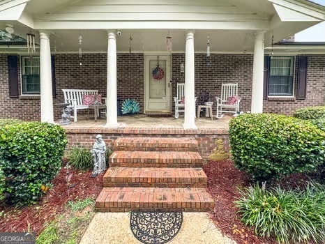 Beautiful home on 2.23 acres. It is a brick ranch with full unfinished basement. The basement is stubbed for rooms and there is plumbing for a bath. Upstairs on the main there are 3 bedrooms and 2 full baths plus an office. this home has a beautiful large foyer as you enter from the covered rocking chair front porch. There is a formal living room with fireplace and formal dining room. The kitchen has a breakfast area with large corner hutch that will stay. Off the kitchen is a beautiful sunroom across the back of the home. There are vertical blinds that will remain. The sunroom overlooks a beautiful backyard. This home has a 2 car carport. At the end of the carport there is a one bedroom, one bath apartment. It has an eat in kitchen and living room. There is heat and air and also has a wood burning stove in the living room. It has kind of a mountain cabin feel The owner has rented it out in the past but could be a great place for parents, in-laws or teenagers. There are many possibilities. It also has its own septic tank. The home and apartment have a total of 2748 Square Feet. That square footage is for home and apt that is above grade. The unfinished basement is below grade and is approx 1800 sq ft.