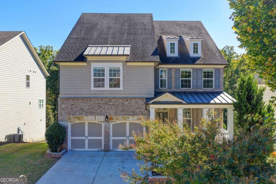 Welcome to 765 Grove Valley Drive - where refined charm meets family-friendly living. This stately residence commands your attention with its graceful facade, classic trim, and inviting front porch, all framed by well-manicured landscaping that hints at the care and attention within.Step inside, and you're greeted by a luminous foyer that flows seamlessly into the heart of the home. Sunlight filters through generous windows, casting soft patterns on hardwood floors and highlighting the architectural detail that runs throughout - from crown moldings to transom windows and open archways that enhance sight-lines. The main living areas are designed to move with you: an elegant formal dining or sitting room, a cozy living space warmed by natural light (or perhaps a fireplace), and a chef's-worthy kitchen that effortlessly blends beauty and utility. Imagine sleek countertops, abundant cabinetry, an island for gathering, and perhaps a windowed breakfast nook where morning light fuels your day. The primary suite is a quiet retreat: generous in size, with a tranquil ambiance, space for a reading nook or sitting area, and an en-suite bath that pampers with dual vanities, a soaking tub, separate glass shower, and a closet that balances style and functionality. Three (or more) secondary bedrooms continue the theme of comfort and light. Bathrooms echo the home's refined style with quality finishes and thoughtful touches. If there's an upper-level bonus room or loft, it adds flexibility - a playroom, media lounge, or office. Downstairs, the finished basement is a game changer. Picture it as a sprawling second living zone - ideal for a theater, recreation room, workout area, or guest suite. With full-height ceilings, defined spaces, and natural light (via egress windows or walk-out access), it's as livable as the upper levels. Built-in storage, a wet bar, or a half/full bath here would only elevate its appeal. Finally, the outdoor space complements the home's interior. A back patio, deck, or covered porch beckons for cookouts, evening conversations, or quiet mornings with coffee. Mature greenery, privacy screening, and tasteful hardscape or plantings bring the yard to life as an extension of the home. Every element - from the lighting to flow to the extra living space - feels intentional. This is more than a house; it's a canvas for life's moments - from daily routines to celebrations. Don't miss your opportunity to make this home your own - schedule a tour and see how 765 Grove Valley blends elegance, flexibility, and modern comfort.