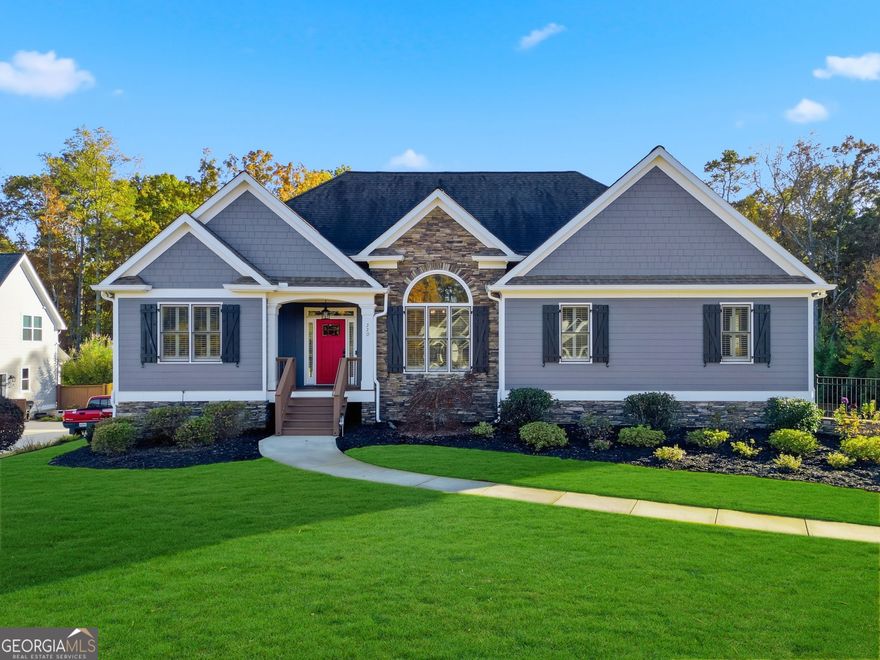 Check out this custom built ranch in Cherokee County! This home sits on a 1 acre lot and features a private, fenced back yard with a heated salt water pool and an open concept split bedroom floorplan with 3 bedrooms and two baths on the main level + a finished basement to include an additional bedroom, a bathroom, a living space and an additional laundry room (which is nice to have at pool level!). The 3 car garage has an epoxy floor coating and is extra deep to offer ample space for parking and storage! Throughout you will see many upgrades such as coffered ceilings in the family room, two stone fireplaces (one in the living room + one on the covered porch), a spacious kitchen granite countertops and upgraded appliances, hardwood floors throughout the entire main level and basement, tile flooring in all bathrooms and the laundry room, two large walk-in closets in the owner's suite, a spacious master bathroom with his/hers sides, plantation shutters throughout, an alarm system, tongue and groove ceilings on the front and back porches, a large covered back porch and grilling deck over looking the pool, an irrigation system in the front and side yards, a home generator, two hot water heaters, and so much more. This home has been extremely well cared for and meticulously maintained. The exterior was painted in 2023, the deck has been freshly stained and extensive landscaping has been done. This location sits right between Canton and Cartersville, offering easy access to both I-575 and 75, as well as Lake Allatoona.