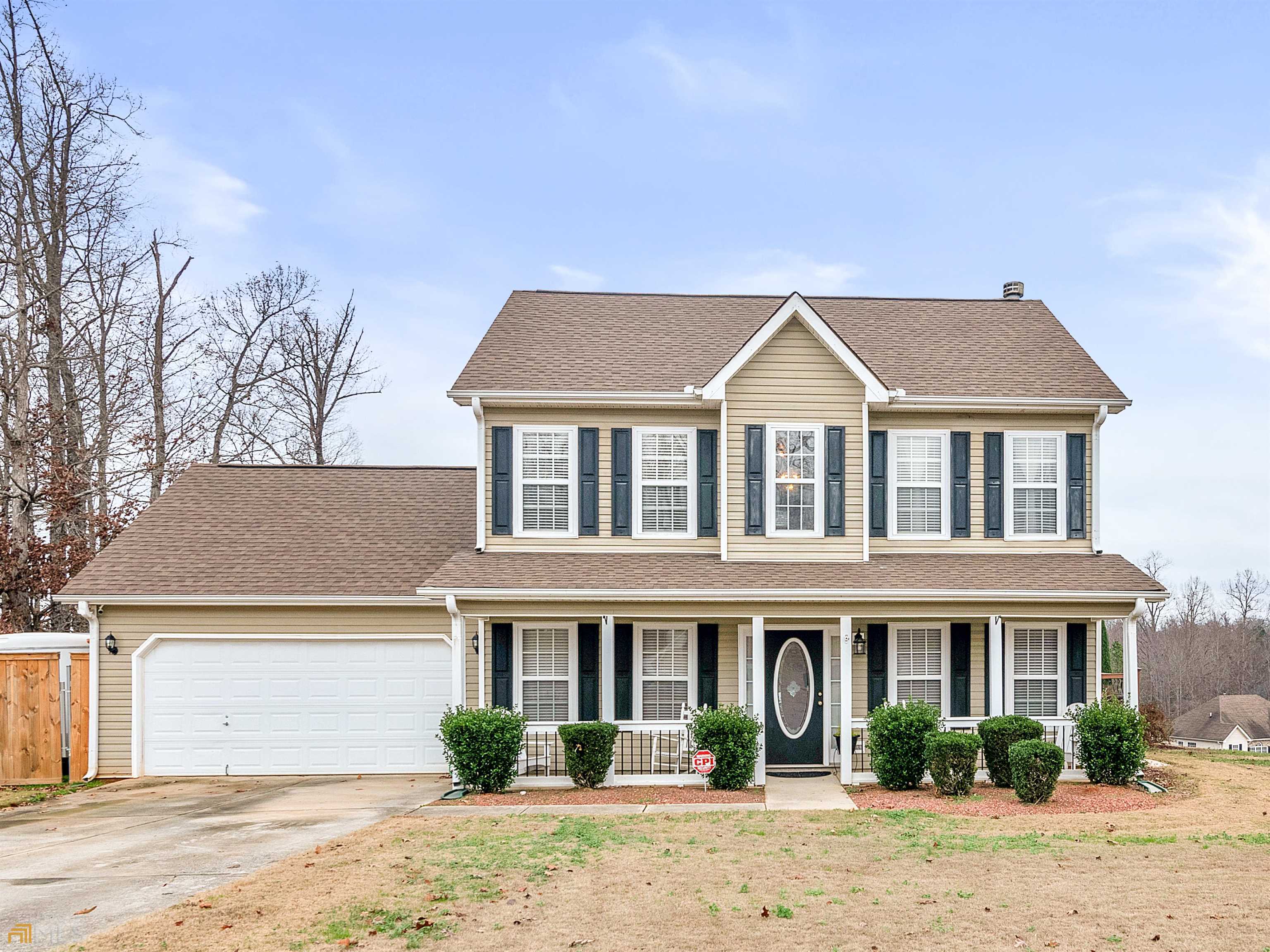 Don't miss relaxing on the front porch and big, back deck of this rambling corner lot before stepping into your move-in ready family home. Hardwood floors throughout welcome past your formal dining room and den to your family room with fireplace, that opens to the informal dining area and your kitchen with warm wood cabinets. The upstairs pampers you with a primary suite offering coffered ceiling and ensuite bath. Blinds throughout. Privacy fence. No HOA. Ask how you can receive up to $1500 credit by using one of our preferred lenders. Exclusions may apply.