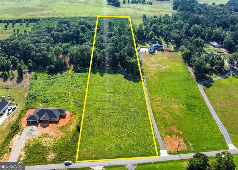 RARE FIND! Ever dream of building your own home on a few peaceful acres, but still want to be close to town? Here's your shot-5.71 beautiful acres just outside of historic Euharlee, only 15 minutes from downtown Cartersville! The land is a great mix of cleared pasture up front and hardwoods with small pines in the back-perfect if you like a little privacy. There's already a homesite cleared, a Level 3 soil test completed (yep-it passed!), utilities at the road, and even a driveway pre-approved with the County. No covenants. No HOA. Just you and your dream home. Surrounded by custom homes valued at $650K+, this is a rare resale opportunity in an up-and-coming area. Less than a mile from Joe Cowan Park, the Etowah River, and the Euharlee boat ramp. Don't sleep on this one-it's not going to last.