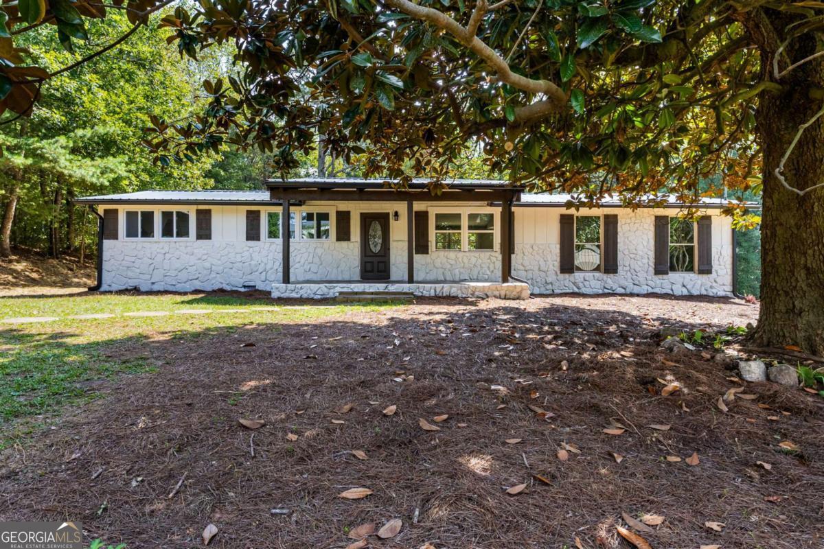 Welcome to 1265 Horsley Mill Road! Tucked back from the road on 5 beautiful acres, this freshly renovated home offers privacy, space, and modern updates throughout. Every detail has been thoughtfully refreshed - from the new front porch and back deck to the new gutters, HVAC system, and flooring. Inside, the kitchen shines with new cabinets, granite countertops, and newer appliances, while the entire home boasts fresh paint, updated plumbing fixtures, and revised lighting for a bright, move-in-ready feel. A brand-new owner's suite has been added, featuring a spacious walk-in closet and a luxurious private bathroom, creating the perfect retreat within the home. The property itself has been transformed into a secluded oasis. Years of overgrowth have been cleared, opening the land to create usable outdoor space while maintaining a private, peaceful setting. Perfectly situated in the Carrollton City / Central School District, this home also offers the convenience of being just minutes from all that Carrollton has to offer - shopping, dining, and the University of West Georgia. Come experience the blend of comfort, privacy, and location that makes 1265 Horsley Mill Road such a special opportunity!