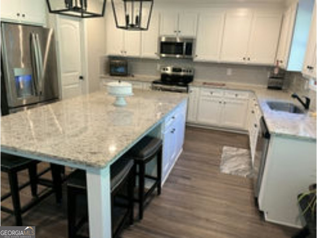 This home is located on a gorgeous lot in a well-kept neighborhood in Good Hope. This open floor plan offers a two story family room with brick fireplace, with built in bookcases. The kitchen is the best feature of the home, including a butler's pantry, ton of cabinet space, and a large island with available seating and storage space. Master on the main. Upstairs is 2 bedrooms with Jack & Jill bath and a third bedroom with full bath.