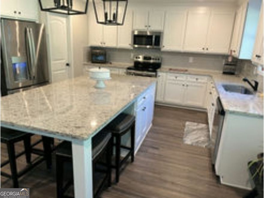 This home is located on a gorgeous lot in a well-kept neighborhood in Good Hope. This open floor plan offers a two story family room with brick fireplace, with built in bookcases. The kitchen is the best feature of the home, including a butler's pantry, ton of cabinet space, and a large island with available seating and storage space. Master on the main. Upstairs is 2 bedrooms with Jack & Jill bath and a third bedroom with full bath.