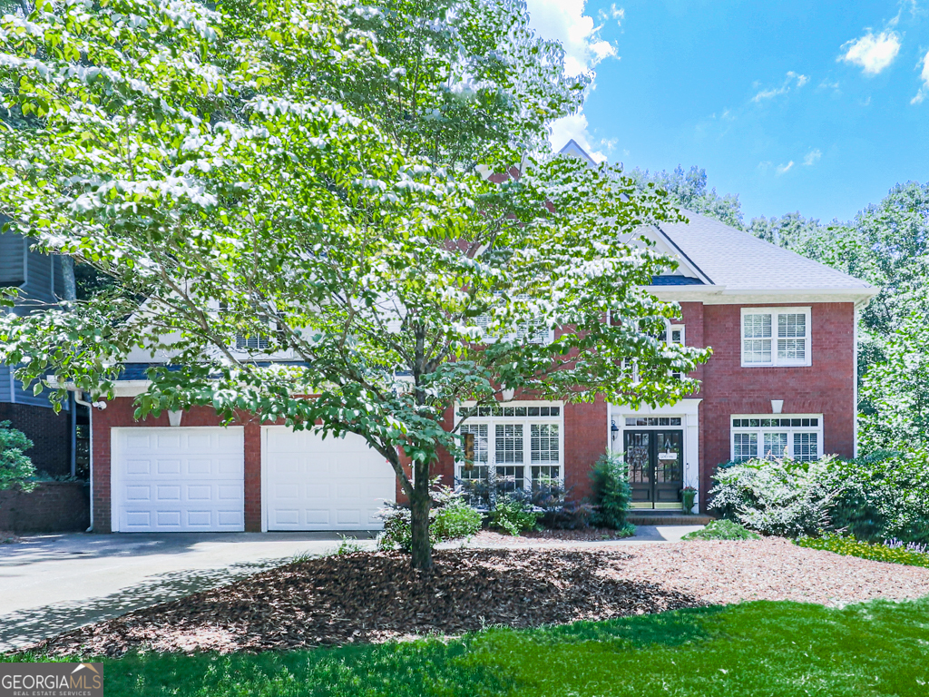 A perfect place to call home! This 5BR/3.5BA home is nestled in The Fairways, a golf community with top-tier amenities including a clubhouse, pool, tennis, pickleball, and playground. The open kitchen flows into a spacious living room with a stunning two-sided stone fireplace shared with the sunroom-a perfect spot for morning coffee. Upstairs you'll find generously sized bedrooms and a peaceful primary suite with a spacious en-suite bath. The finished basement offers hardwoods, a second kitchen, wet bar, murphy bed, and full bath. Outside, enjoy the covered porch which is perfect for watching your favorite game. The backyard is large and flat with room to play or entertain