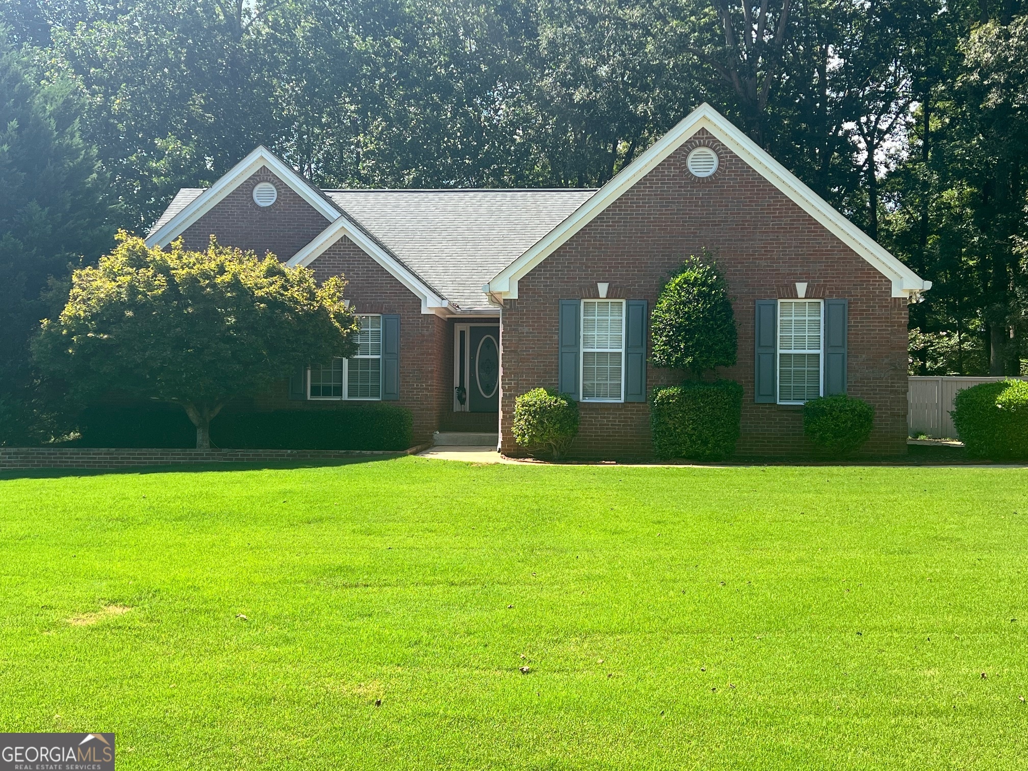 Beautifully updated 3,414 square foot 4BR/2BA 4-sided brick ranch on full basement in desirable Winder location! Home features new hardwood floors throughout, fresh paint, new kitchen countertops, and a newly renovated master bath. Spacious family room with large sunroom off the back, fireplace, separate dining area, and oversized bedrooms. Full basement is 50% finished, stubbed for a full bath, and offers a large workshop, storage area, and cedar closet-perfect for expansion. Outdoor living at its best with a large deck, concrete patio, and outdoor storage building on a private 1.43-acre wooded lot. 2-car garage and plenty of space for hobbies or entertaining. Convenient location with endless potential-don't miss this move-in ready gem!
