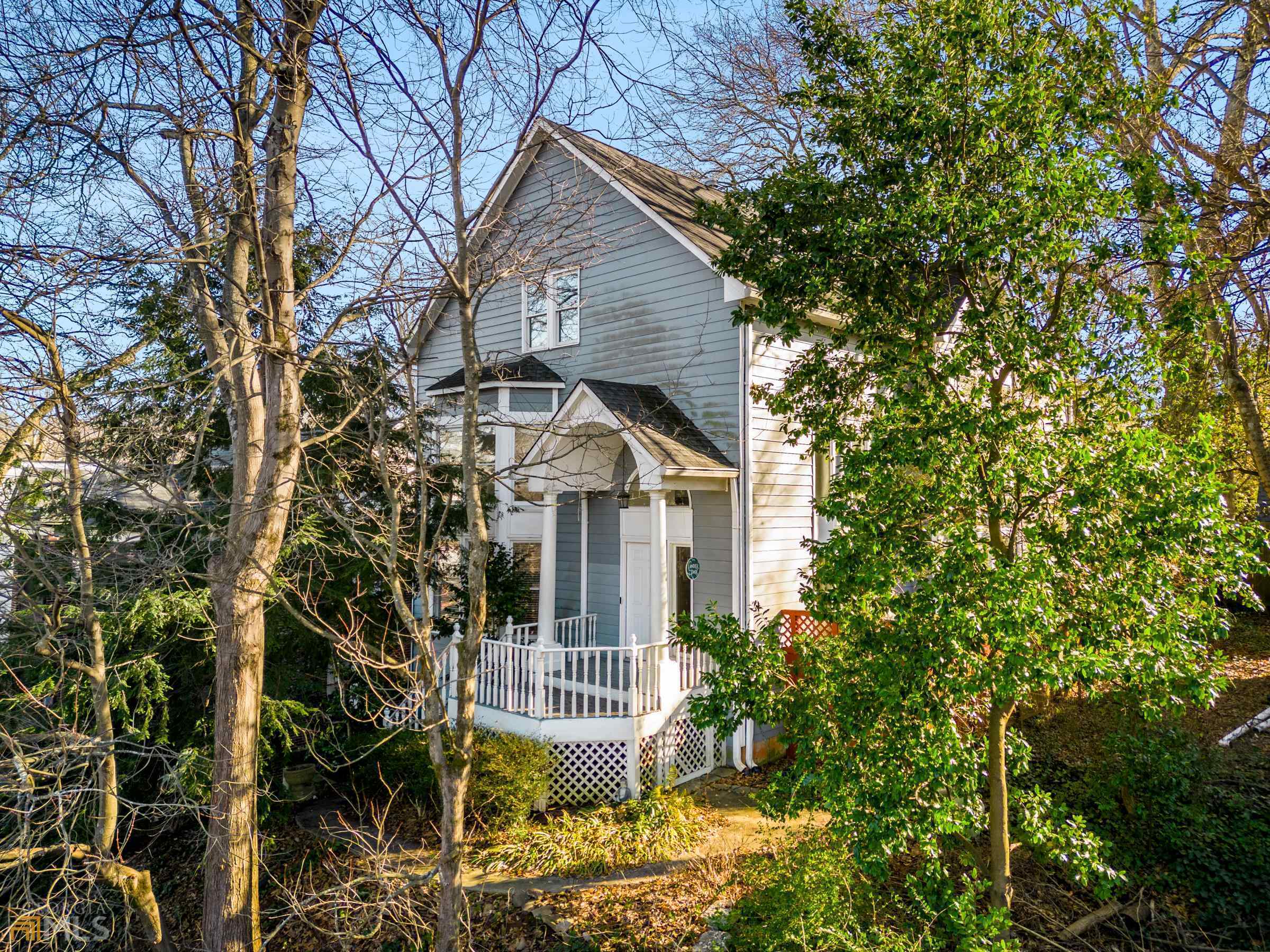 Incredible opportunity to live in the heart of Candler Park! 4BR/3.5BA spacious, private hilltop home with a partially finished basement & 2-car garage plus deeded exterior space. Open & bright 2-story vaulted ceiling living room features fireplace and wall of windows. Hardwoods throughout entire home. Not one, but two owner’s suites—one on each floor. Open kitchen/dining area with granite countertops, wood cabinets & rolling island. Deck & flat, fenced backyard off of kitchen are perfect for outdoor entertaining. Three other large bedrooms upstairs, one bedroom is split to be a perfect bonus room for a home office or playroom. The large, partially finished basement is perfect for a gym, studio or media room and is stubbed for a full bath. This is a great opportunity to customize to your needs. Enjoy a maximum walk score while sitting in a private, tree-lined enclave. Incredible value in an excellent school district. Steps to MARTA, Candler Park, tennis courts and pool, as well as the village shops and restaurants including Candler Park Market, Gigi's Italian, The Flying Biscuit, Fellini's, La Fonda Latina and Candler Park. Seller is giving a 1-year First American Home Warranty for Buyer at closing.