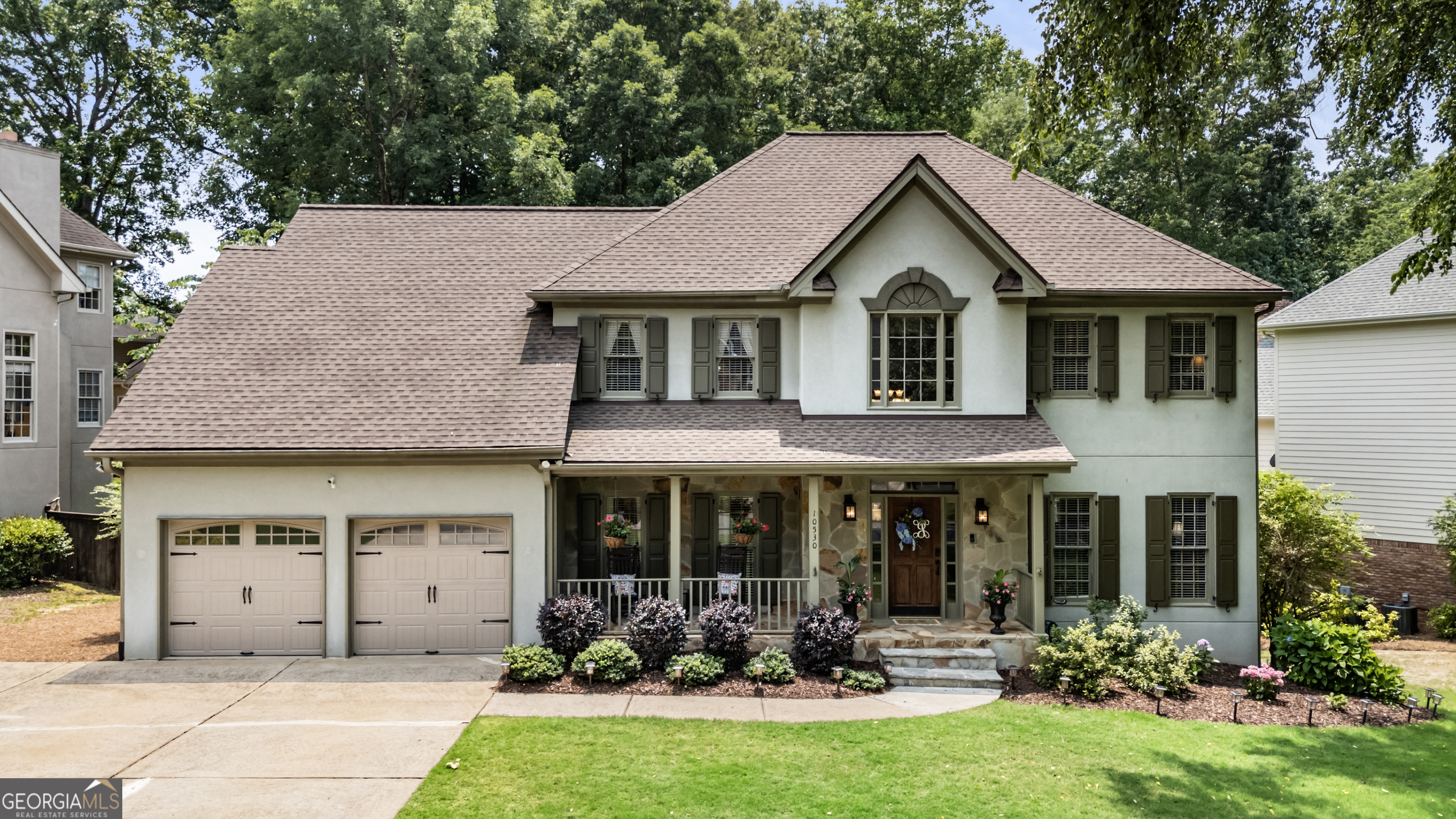 Nestled in the heart of Tuxford-one of Alpharetta's most sought-after swim and tennis communities-10530 Tuxford Drive offers the perfect blend of classic charm, modern upgrades, and everyday functionality. With six true bedrooms, four full bathrooms, and a fully finished terrace level, this beautifully maintained home provides plenty of space to live, entertain, and grow in a vibrant, family-friendly neighborhood. From the welcoming front porch and flat, manicured lawn to the timeless exterior, this home delivers instant curb appeal. Inside, you're greeted by a soaring two-story foyer and gleaming hardwood floors that flow throughout the main level. The layout is both elegant and practical, featuring a formal living room, a spacious dining room, and a dramatic fireside family room with vaulted ceilings and a stunning floor-to-ceiling brick fireplace. The kitchen is thoughtfully designed for both style and function-offering abundant cabinet space, granite countertops, double ovens, a centrally located gas cooktop, and casual bar seating. Recent updates include freshly painted cabinetry, new hardware, updated lighting, and a new faucet. The sunlit breakfast room, framed by large windows, is the perfect spot to enjoy your morning coffee while overlooking the peaceful backyard. Upstairs, the oversized primary suite is a true retreat with tray ceilings, a walk-in closet, and a spa-inspired bath complete with dual vanities, soaking tub, and separate shower. Secondary bedrooms are spacious and bright-ideal for family, guests, or flexible use as home offices or playrooms. he finished terrace level adds incredible value and versatility, featuring a second fireplace, guest suite, large media or recreation area, and walk-out access to a covered patio and level backyard-perfect for entertaining, playtime, or relaxing in the shade. Major systems and features have been thoughtfully updated, including: New roof (2021); New water heater (2021); Both HVAC systems replaced (2022-2023); New decking and fresh deck paint (2024); Exterior wood trim replaced and painted (2024); Full interior repaint (2023); Updated kitchen hardware, lighting, and faucet (2023-2024) Tuxford isn't just a neighborhood-it's a community. Residents enjoy a calendar full of social events, a competitive and well-loved swim team, active tennis leagues, and clubs for all ages. Top-rated schools, proximity to Avalon, North Point, downtown Alpharetta, and easy access to GA-400 make this location unbeatable. Whether you're looking for more space, move-in ready comfort, or a sense of connection and community-10530 Tuxford Drive is ready to welcome you home!