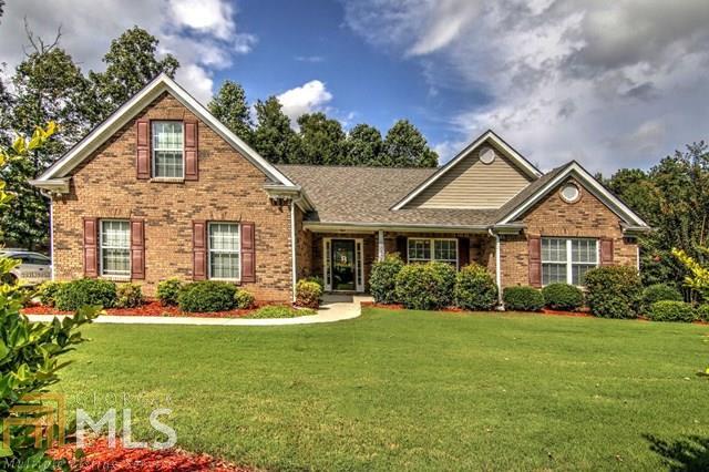 Large brick front ranch with vaulted ceilings throughout! Wide open floor plan featuring a formal dining area, formal living room, and split bedroom plan. A huge kitchen that opens to a breakfast area, formal dining, and TV room. Kitchen features solid surface counters and stainless appliances. Master suite has separate walk in closets, dual vanities, walk in shower, and separate tub. The backyard is fenced in and features a matching shed, covered patio, fire pit, and raised bed garden. House is shown by appointment.