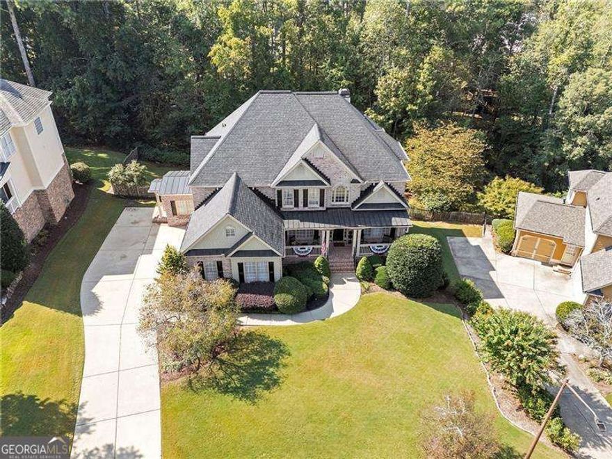 Discover an exceptional opportunity at 3215 Waterhouse Street, a meticulously maintained residence nestled within one of Kennesaw's   most prestigious communities, Highlands at Hamilton Township. Located in the highly regarded West Cobb school district, this remarkable   home blends timeless sophistication with thoughtful, modern enhancements throughout. Enjoy lasting peace of mind with a newer 30 year   architectural roof (installed in 2021) and the enduring beauty of hardwood floors that grace both the main and upper levels. As you step   inside, you are welcomed by a truly rare feature - a private library adorned with custom built-in bookshelves and elegant designer   lighting, creating the perfect sanctuary for focused work or quiet reading. Across the foyer, a formal dining room offers a refined space   ideal for hosting special gatherings and sharing meaningful family moments. The chef's kitchen is a culinary enthusiast's delight, appointed   with a gas cooktop, double oven, abundant cabinetry, and stylish under cabinet lighting. Two expansive living areas offer both flexibility   and warmth, whether you are entertaining guests or enjoying a quiet evening at home. The three-car garage has been thoughtfully   upgraded with epoxy flooring, wainscoting, and insulated doors, while the adjacent mudroom and laundry area combine functionality with   charm. Upstairs, four spacious bedrooms await, including an expansive primary suite with tray ceilings, a cozy sitting area, and a luxurious   en suite bath. The walk-in closet is beautifully outfitted with custom organizational systems and features a wall-mounted ironing board for   added convenience. The finished basement offers endless possibilities, featuring a large open recreation space, a kitchenette, a full   bedroom and bathroom, a workshop, and generous storage - perfect for multigenerational living, creative hobbies, or effortless   entertaining. Step outside to your private outdoor retreat, where a low maintenance TREX deck overlooks a beautifully landscaped   backyard. Enjoy evenings around the custom stone fire pit, relax on the flagstone patio, and appreciate the ambiance created by soft   accent lighting and stone steps that complete this serene space. This home is more than a residence. It is a lifestyle, located in one of   West Cobb's most desirable school zones, served by Harrison High School. This home has been lovingly maintained and ready for your   personal touch. Schedule your private showing today and experience the perfect harmony of comfort, beauty, and timeless design.