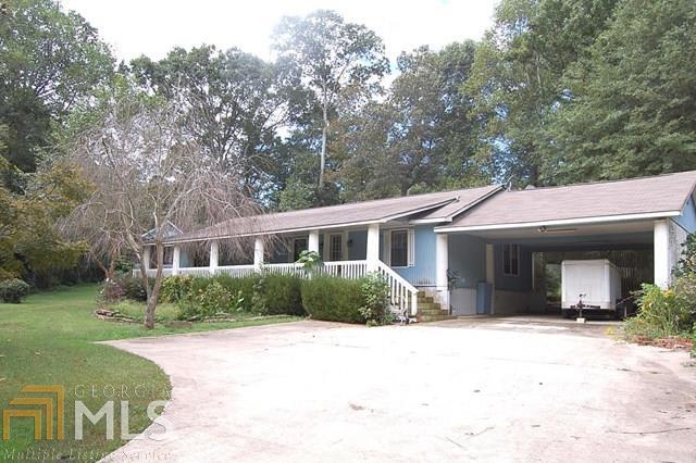 Ranch style home and a separate one bedroom apartment on 1.16 acres. Lots of space for the money. Live in one, rent the other for extra income, help with the mortgage or for the in-laws. Get investment opportunity. Private park like grounds with beautiful trees, creek and outbuildings.