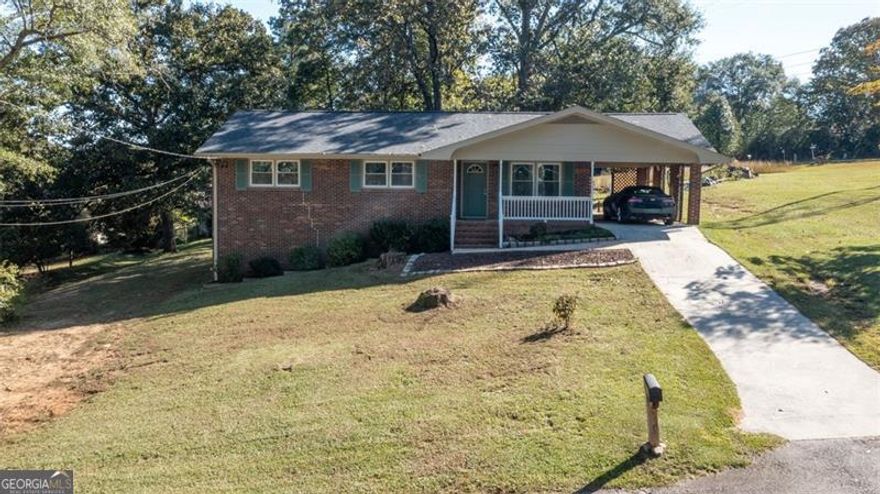 Welcome to 469 Plantation Drive - a beautifully maintained ranch-style home offering comfort, privacy, and convenience with no HOA! This inviting 3-bedroom, 1.5-bath home is truly move-in ready, featuring a newer roof, HVAC system, hot water heater, and appliances for peace of mind. The partially finished basement adds flexible space for a gym, hobby room, or recreation area-perfect for today's lifestyle. You'll appreciate the attached carport for easy everyday parking, plus an additional detached carport/workshop with storage that's ideal for tools, projects, or extra vehicles. With ample parking space, there's plenty of room for guests, RVs, or boats. Enjoy the best of both worlds-quiet country living with the convenience of nearby amenities. Located just 30 minutes from Athens, this property is close to shops, dining, and parks, including Fort Yargo State Park. Close proximity to elementary, middle, and high schools, all within about a mile. A rare bonus: the Georgia Power Tower on the property qualifies for annual tax benefits, adding even more value. If you're looking for a move-in ready home with updates, space, and no HOA, this one checks every box. Schedule your showing today and discover all that 469 Plantation Drive has to offer!