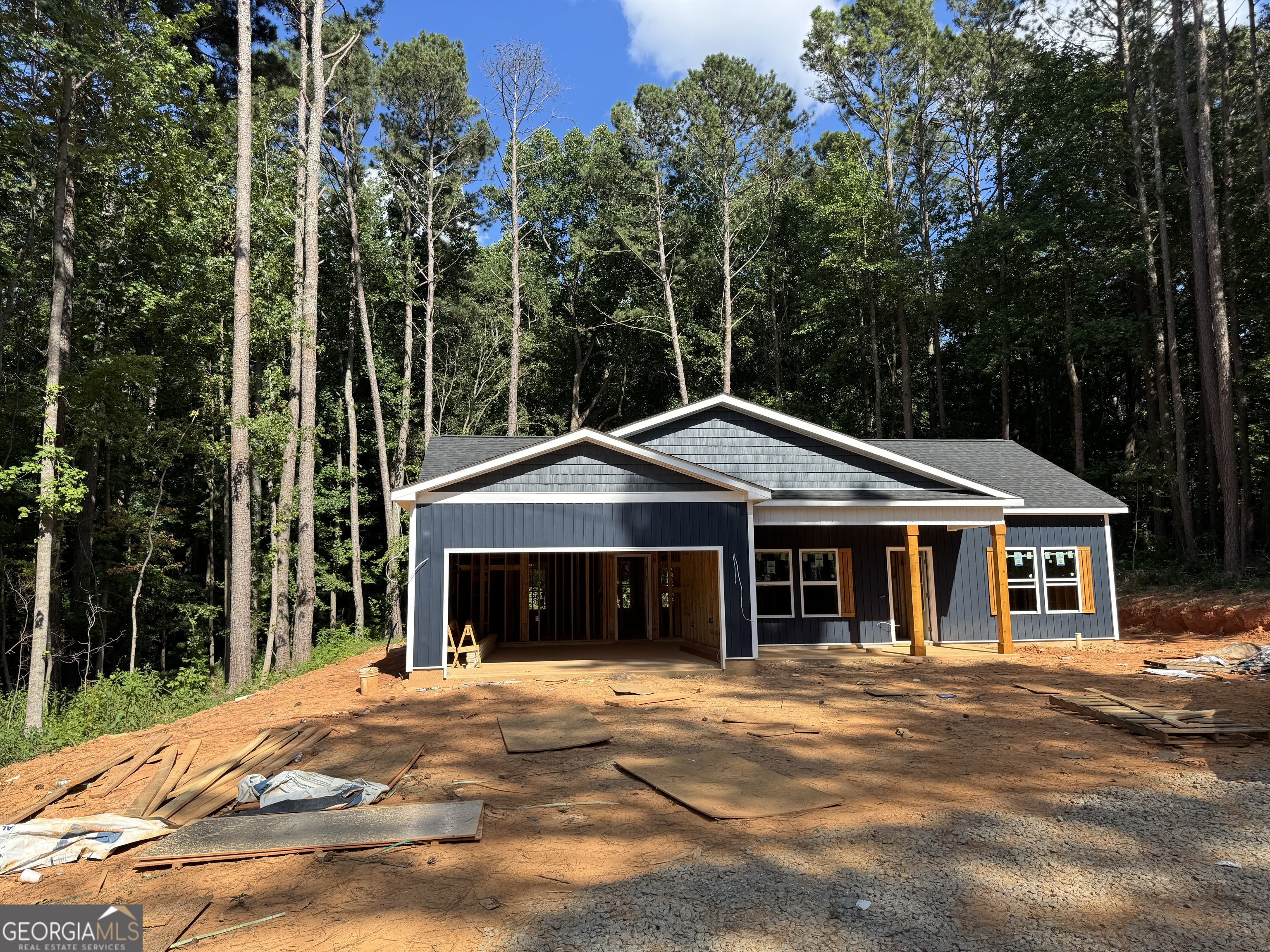 New Construction !! House will be complete end of august 2025! The pics are stock photos not of actual house!!!! BRAND NEW STEP LESS FARMHOUSE style RANCH home with OPEN FLOOR overlooking LAKE! This home features luxury & style on 1 acre private wooded lot! This marvelous open concept features 3 full bedrooms & 2 baths which is perfect for entertaining. The Gourmet kitchen features STAINLESS APPLIANCES, WHITE CABINETS, GRANITE COUNTERTOPS & pantry. This dream culinary kitchen features CUSTOM ISLAND that overlooks the spacious family room with VAULTED ceilings! The amazing primary suite leads to an incredible ensuite bath with LARGE breathtaking TILE SHOWER & huge walk in closet. Enjoy your morning coffee on front porch overlooking LAKE or entertaining guests on back PORCH overlooking a spacious private wooded backyard! Standard options offer gorgeous LUXURY LVP in kitchen, living room, entry & baths, carpet in the bedrooms, granite, tile shower walls & black fixtures. Photos are of the actual house under construction on different address. Amazing location minutes to shopping and restaurants with NO HOA! Great School District! SPECIAL FINANCING AVAILABLE! CALL TODAY FOR MORE INFORMATION on our builder RATE BUYDOWN!! Buyer to receive up to $5K incentive towards closing costs or rate buydown with preferred lender.