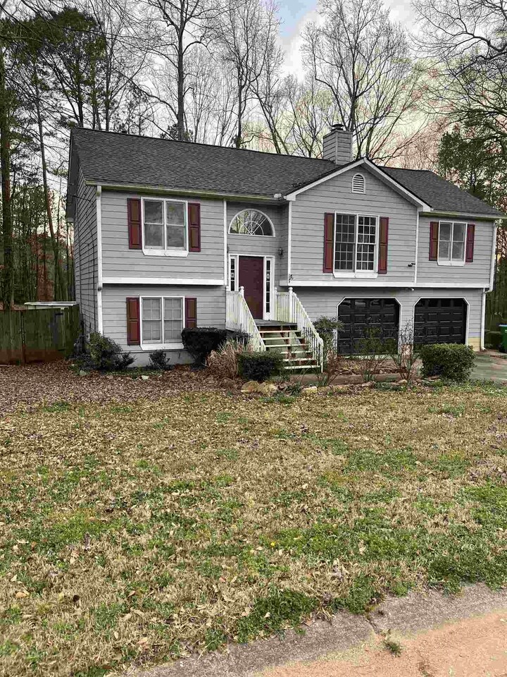AS IS... Split level freshly painted 3 bedroom 3 bathroom with 2 bonus rooms in basement. Tile floors throughout the residence. Nest thermostat. Tiled bathroom. New kitchen cabinets with island, set up for double oven. Living room features ample natural lighting and a gas log fireplace. Split bedroom floor plan, master has his/her walk in closets and tiled shower. Basement has 2 bedrooms and 1 bathroom. Oversized laundry located in basement with tiled floor. Screened in back porch with fans for entertaining on the nice summer nights. Tankless water heater and so many upgrades.