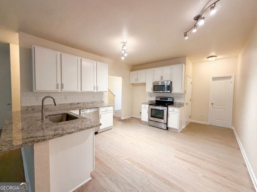 Photo of 5080 Windsor Forrest Lane, College Park, GA 30349 (MLS # 10761190)