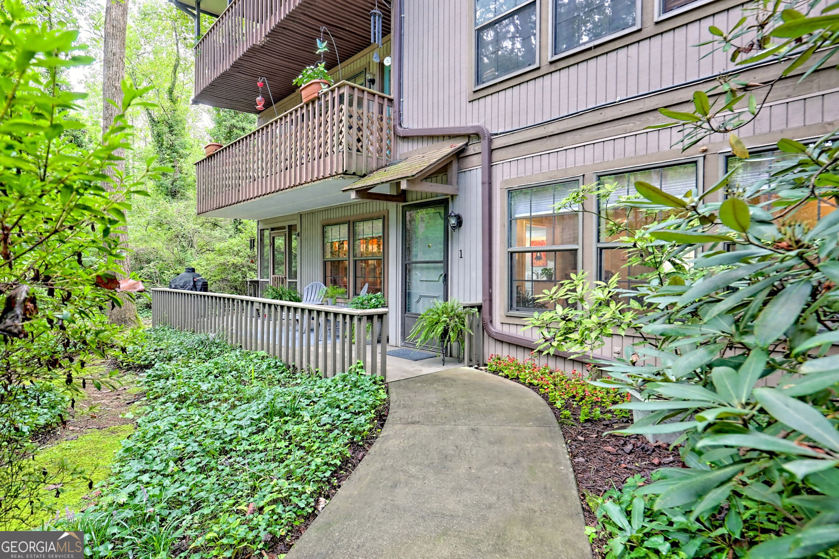 Experience the convenience of in-town living with this charming 2 bedroom, 2 bathroom terrace level condominium, just minutes from all the shopping, dining, and entertainment Downtown Clayton has to offer. Nestled in the desirable Stornoway community, this well-maintained unit is located in the Dunvegan building, a quiet 6-unit complex. Situated on the lower level, the condo features a welcoming living room with a cozy gas fireplace, a functional galley-style kitchen, a separate dining area, and a private enclosed porch/sunroom perfect for year-round enjoyment. Thoughtfully designed with abundant storage, the home also includes a covered carport and step-free entry via well-maintained sidewalks. Monthly HOA dues of $160 cover exterior building and grounds maintenance, common insurance, and pest control, making this an easy-care option for full-time living or a weekend retreat.