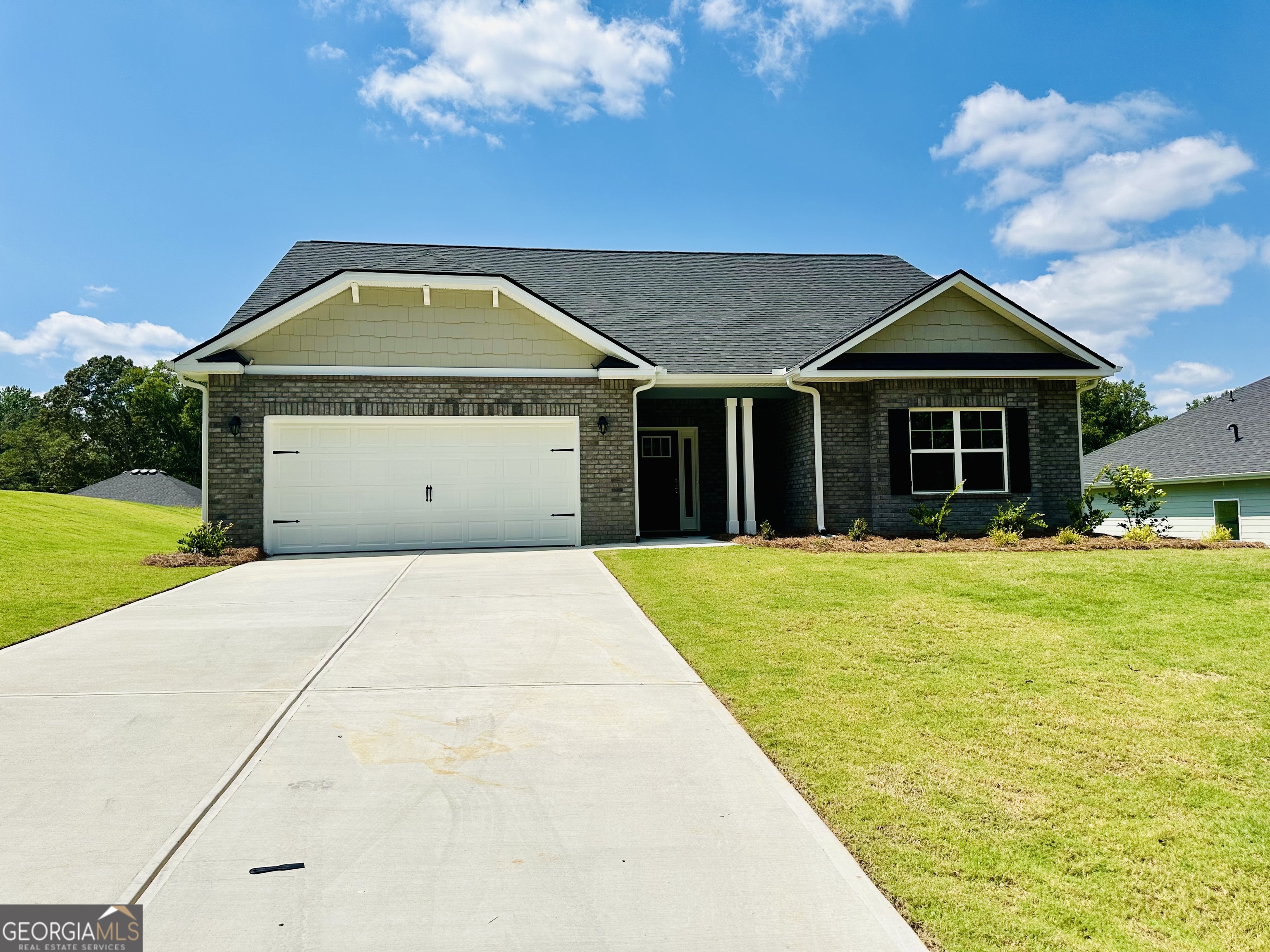 Welcome to this "Park Place Sanctuary" - A Stunning 4 Bedroom / 3 Bed Retreat in Park Place community! *Price Reflects Builder Incentive* Imagine waking up in your dream home in Park Place, affectionately known as "The Friendly City", Bowdon, GA. This beautifully crafted 2,604 sq. ft. home features 4 spacious bedrooms, 3 full bathrooms, and a thoughtful 1.5-story design with a large bonus room upstairs-ideal for a guest suite, media space, office, or playroom. From the moment you enter the welcoming foyer, you're embraced by natural light, a flowing open-concept layout, and classic finishes that make every day feel special. At the heart of the home is a stunning gourmet kitchen with a generous granite island, walk-in pantry, and seamless connection to the dining and family room-designed for both connection and comfort. The main-level owner's suite is a true sanctuary, offering a spa-like bath with soaking tub, tiled shower, dual vanities, and a spacious walk-in closet. Two additional main-floor bedrooms provide flexibility and privacy for guests or family, while the upstairs bonus space, with its own 4th bedroom and full bath, brings even more options to meet your lifestyle. Walking outside to a covered patio overlooking your private backyard oasis, ready for slow mornings, summer cookouts, or peaceful evenings. Whether hosting lively gatherings or enjoying a quiet evening, this home is designed to enhance every moment of your life. Built for quality and efficiency, "The Park Place Sanctuary" features architectural shingles for durability and two water heaters to ensure lasting comfort and peace of mind. you'll enjoy natural light throughout the day, making every room feels warm and inviting. Situated in Carroll County, minutes from I-20, local Bowdon schools, Tanner hospitals, and the University of West Georgia and West Georgia Technical College along Georgia State Routes 100 and 166, Bowdon combines small-town charm with convenient access to nearby communities, local downtown restaurants, and boutique shops. Near Carrollton Greenbelt walking trails, Little Tallapoosa, Hays Mills, and John Tanner Parks, great for outdoor life, hiking, biking, walking, boating, and fishing. USDA financing eligibility, and only $1,000 in earnest money required - this is your opportunity to own a residence that perfectly blends style, efficiency, and affordability. Schedule your private tour today and start making memories in "Park Place Sanctuary." Homes are under construction, please use caution when touring the property.