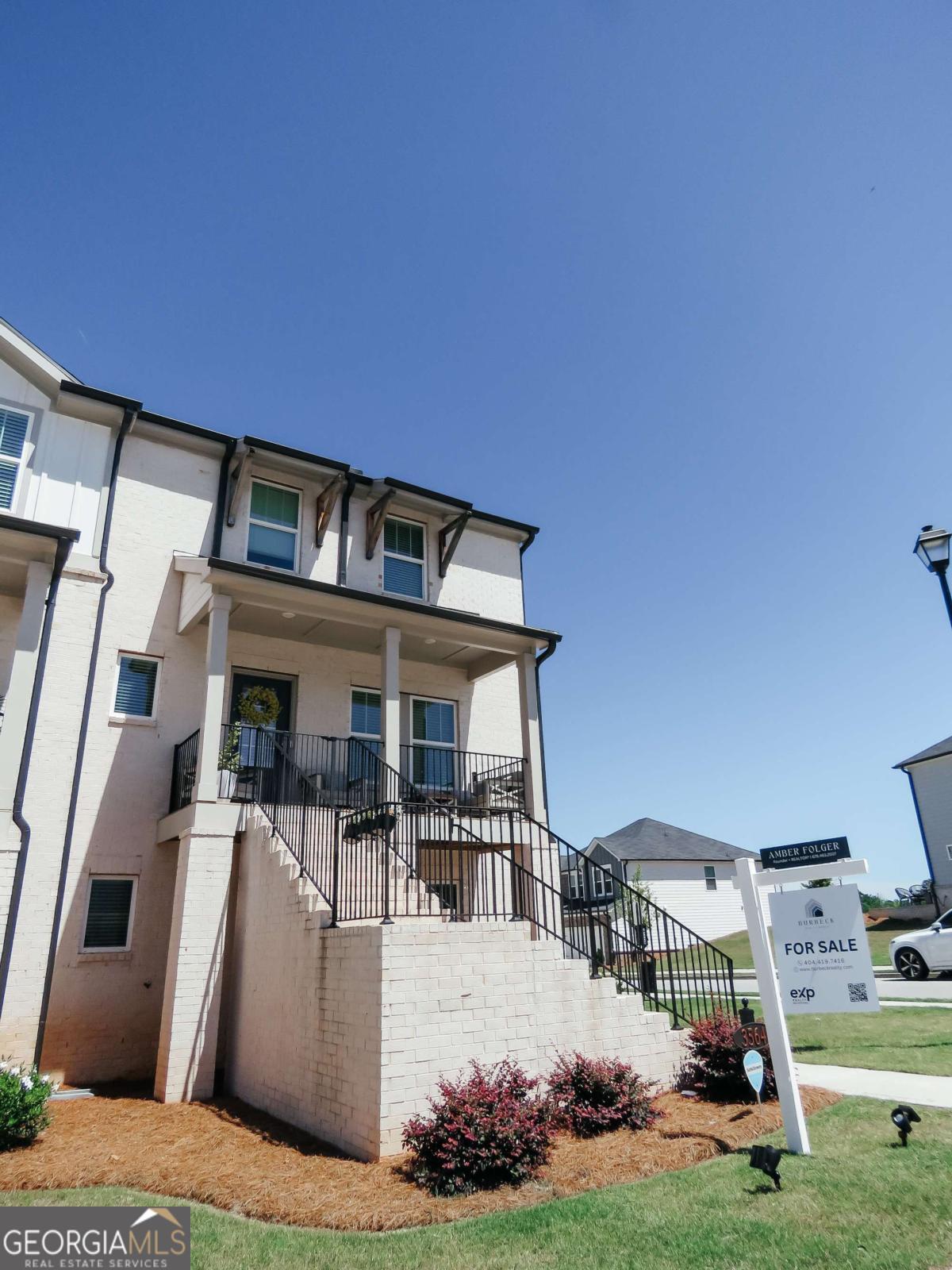 Like new, 4 bed / 3 full bath, end unit MODEL HOME! Enjoy the upgraded elegant design package with Kinsdale White Linen Cabinets and LVP throughout. Main level features stone countertops, chefs kitchen, and open living. Upstairs you will find primary with ensuite bath, two additonal rooms, and full bath. Lower level offers flex room, full bath and bedroom, perfect for guests, or an in-law-suite. The highly sought after Fairway Series at Sweetwater Green offers three-story townhomes featuring the latest design trends. Enjoy all that Lawrenceville has to offer with close proximity to shopping and dining plus convenient access to I-85 and GA-316. Planned amenities include a community clubhouse, a swimming pool and green spaces. Model home unit, built 2023, lived in since July 2024. One of four units with a full front porch and end unit side windows.