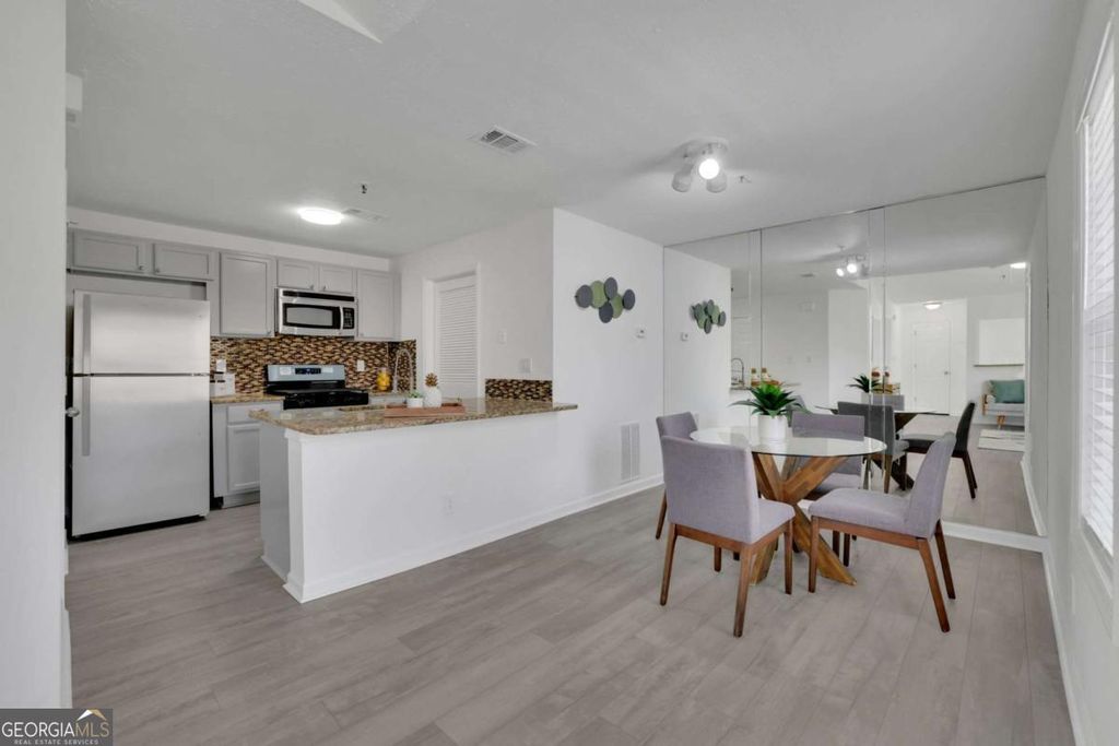 Photo of 5616 River Heights Crossing SE, Marietta, GA 30067 (MLS # 10720115)