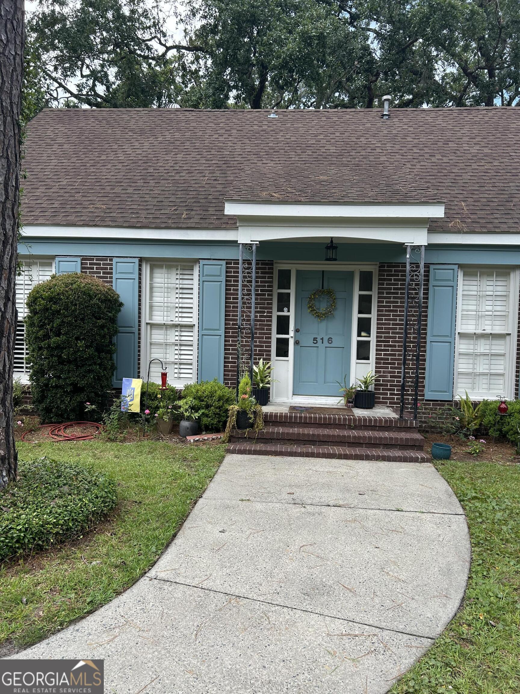 Desirable mid-south island location on a winding tree-lined street for shady walks. Only minutes to shopping, restaurants and the beach, plus easy island on/off access! NO HOA, recent updates, situated on a large lot with mature landscaping and a storage/gardening shed. This charming, spacious brick Cape Cod style home features 2 main level bedrooms and 2 upstairs bedrooms with 2.5 baths. Plantation shutters add elegance, and a gas fireplace is perfect for chilly nights. The large screened porch is a peaceful oasis to enjoy nature in the private backyard. AC system new in 2025. Renovated kitchen features quartz counters, beautiful hardwood floors. Plenty of storage, custom banquette seating in dining room , you will want to see this rare find and make it yours!