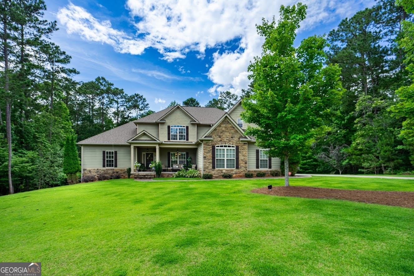 Welcome to 348 Willow Pointe - a stunning lakefront home offering the perfect blend of elegance, space, and outdoor living on the shores of West Point Lake. It has a private dock with a boat lift. It is perfect for boating, fishing, or sunset views- Beautifully landscaped yard with room to roam- Quiet, upscale community in desirable gated subdivision with 4 bedrooms and 4.5 bathrooms, this property is designed for comfort, entertaining, and enjoying the serene beauty of lakeside living. Gourmet kitchen with granite countertops, stainless steel appliances, wall oven, and gas range cooktop. Expansive living room with fireplace and lake views- Luxurious master suite with spa-style bath and walk-in closet and fireplace. Multiple guest suites with private baths- Bonus room ideal for home office or media space. It has a large back deck with an outdoor fireplace. Covered patio perfect for relaxing or hosting gatherings. It has an unfinished basement with over 2,000 sq. ft. It has a community pool, pickle ball court, and tennis courts. Please see private remarks for showing instructions the week of the 4th!