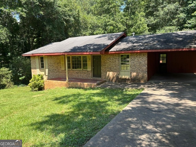 Four-Sided Brick Ranch on Partial unfinished basement having 3 Bedrooms and 1.5 Baths, Living Room, Large Kitchen with Dining Area that opens to Back deck for entertaining that overlooks private wooded back yard. One car carport and plenty of off-street parking. Property is sold AS-IS Only with No Seller Disclosure - No Warranties - Agents MUST read the Agent Private Remarks Section for OFFER SUBMISSION and NO Offers are to be sent to the Listing Broker - NO Blind Offers will be reviewed - If Listing is showing active then it is available to show. Supra Lockbox to Show - Schedule thru Showing Time - For additional info text 678-725-1164 or email listing agent at Patrick@AssetMovingSolutions.com