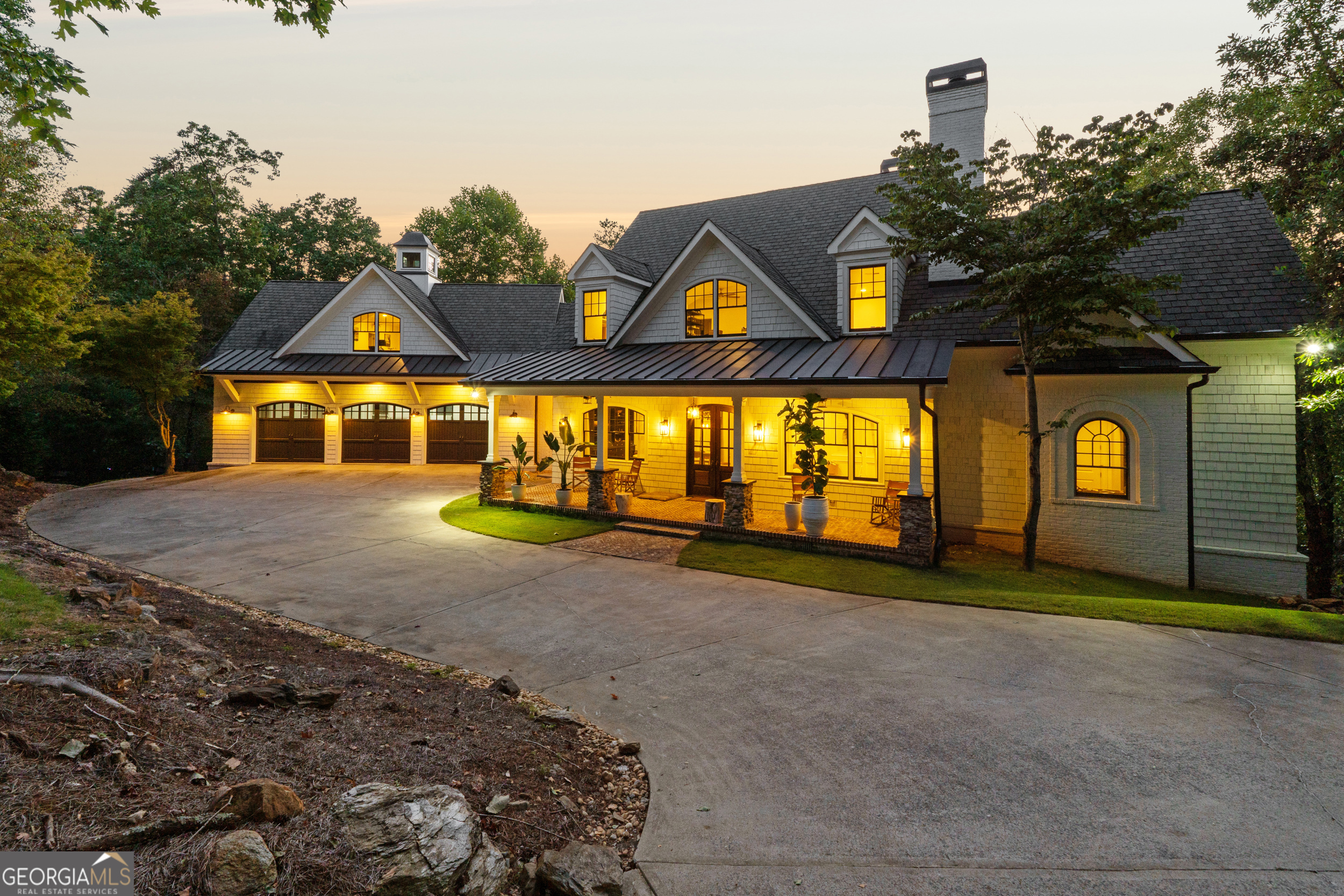Newly updated Mountain estate home in a lake-side gated community located only 1 mile off I-75 on Lake Allatoona. This custom home boasts a luxurious modern feel in a private mountain setting. This 6 bedroom / 4.5 Bath luxury home has it all! A true Chef's Kitchen with WOLF 6 burner range with griddle and dbl oven, SUBZERO refrigerator, VIKING microwave and large kitchen island perfect for entertaining! Master on main. IN-LAW / TEEN SUITE above 3 car garage provides bedroom, living area and full bath. Upstairs has 2 bedrooms with their own bath and 3rd bedroom/office. The lower level features another bedroom suite with full bath, 2nd great room and bonus room + wine cellar and workout room. This is the outdoor enthusiast's dream come true, featuring a beautiful 4 seasons room off the kitchen with fireplace and oversized deck, both overlooking the mountains. Lower level has additional fireplace on patio area and private/level/grassed backyard. 6.94 acre private cul-de-sac homesite provides beautiful mountain views. New interior and exterior paint and light fixtures. Come visit and see why Waterside is the premier development on Lake Allatoona! Waterside is a gated community adjacent to lake allatoona, and Red Top Mountain State Park, only 1 mile from I-75. Amenities inside Waterside include pool, lighted tennis courts, and clubhouse.