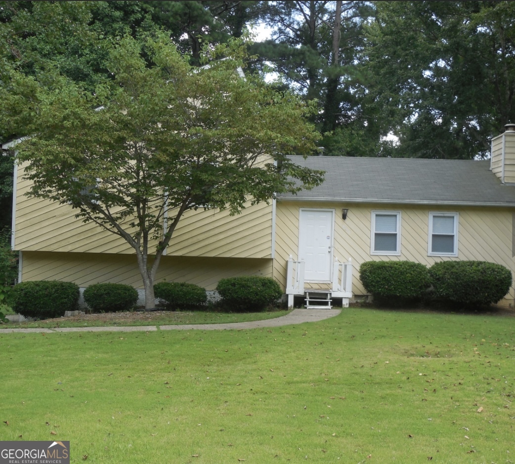 This charming 3-bedroom, 2-bathroom home features a cozy family room and an open dining area. It includes stainless steel appliances and white cabinets in the kitchen, as well as a garage for one car and additional storage. The fenced yard offers privacy with a wooded backdrop, complete with a fire pit and a nice patio for entertaining. Located in a well-maintained subdivision with no HOA, it boasts a beautiful yard and conveniently located to schools, shopping, and restaurants.