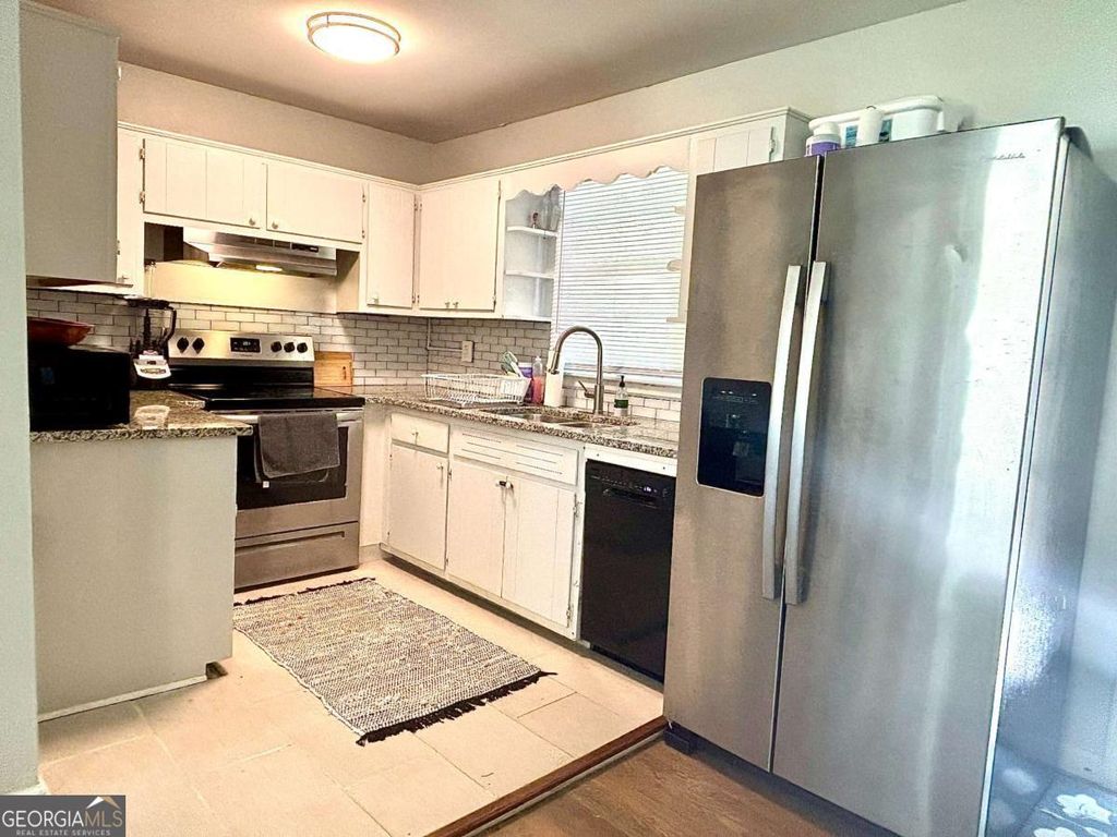 Photo of 4030 Stonewall Tell Road, Atlanta, GA 30349 (MLS # 10659034)