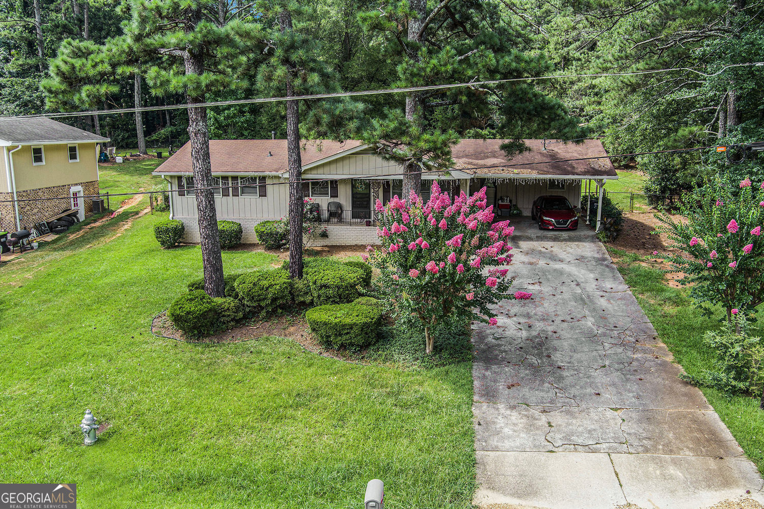 Welcome to this beautifully updated 3-bedroom, 2-bath ranch in sought-after Cobb County - with NO HOA! This move-in ready gem sits on a spacious, fenced lot, offering rare flexibility and functionality for today's homeowner or savvy investor. Enjoy a functional, flowing layout with updated finishes throughout. The expansive yard provides ample room for extra parking, large equipment, recreational vehicles, or even a future pool - making it ideal for buyers needing space and versatility. Situated along the Silver Comet Trail, this property offers a unique blend of privacy, convenience, and outdoor access. Currently tenant-occupied - do not disturb tenants - showings by appointment only. Backyard bonus: a detached building sold AS-IS, perfect for storage, a future workshop, or renovation potential. Whether you're looking for an investment property with immediate rental income or a future primary residence with room to grow, this home offers endless potential in a prime location!