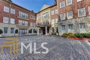 This beautiful, freshly painted condo Inside-the-Perimeter (ITP) in Sandy Springs is an outstanding value at $268,000. Way below true market price. It a 2 BR/2 -+ bath unit that features the largest floor plan in The Regent with 1,741 square feet. Gleaming blonde oak flooring flows from the open dining area and into the adjoining living room. A wall of floor-to-ceiling windows and French doors at the end of the living room allows you to walk out onto your private balcony. Over-sized master bedroom with a generously large walk-in closet. 2nd bedroom has its own fullbath. Large updated kitchen with walk-in pantry has a convenient pass-through window to the dining area. Laundry room in unit, plus guest powder room. The Regent offers excellent amenities, including a fitness center, library, parking garage and a full-time concierge. 10-minute drive into Buckhead and 15 minutes into Midtown. Easy access to the nearby Perimeter Mall, dining, 400, I-85 and I-285.