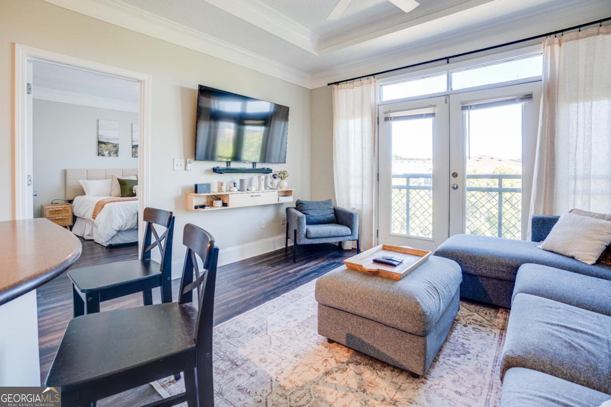 Modern top-floor 2 bed, 2 bath roommate-style condo in Atlantic Station. Features include a dining room, open kitchen/living area, master suite with double vanity, garden tub, separate shower, and walk-in closet. Second bedroom is separated by a hall with laundry and a full bath. Updated water resistant laminate flooring in the main living space. Balcony doors open to view of the park. Perfect for some fresh air on a beautiful day. Walking distance to Atlantic Station shopping, restaurants and entertainment. Easy access to pubic transportation, including the nearby MARTA Arts Center Station. Minutes away from Georgia Tech campus. The Art Foundry community provides resort-style amenities including a pool, fitness center, sauna, and business center. Don't miss this opportunity for modern living and city life at its best.